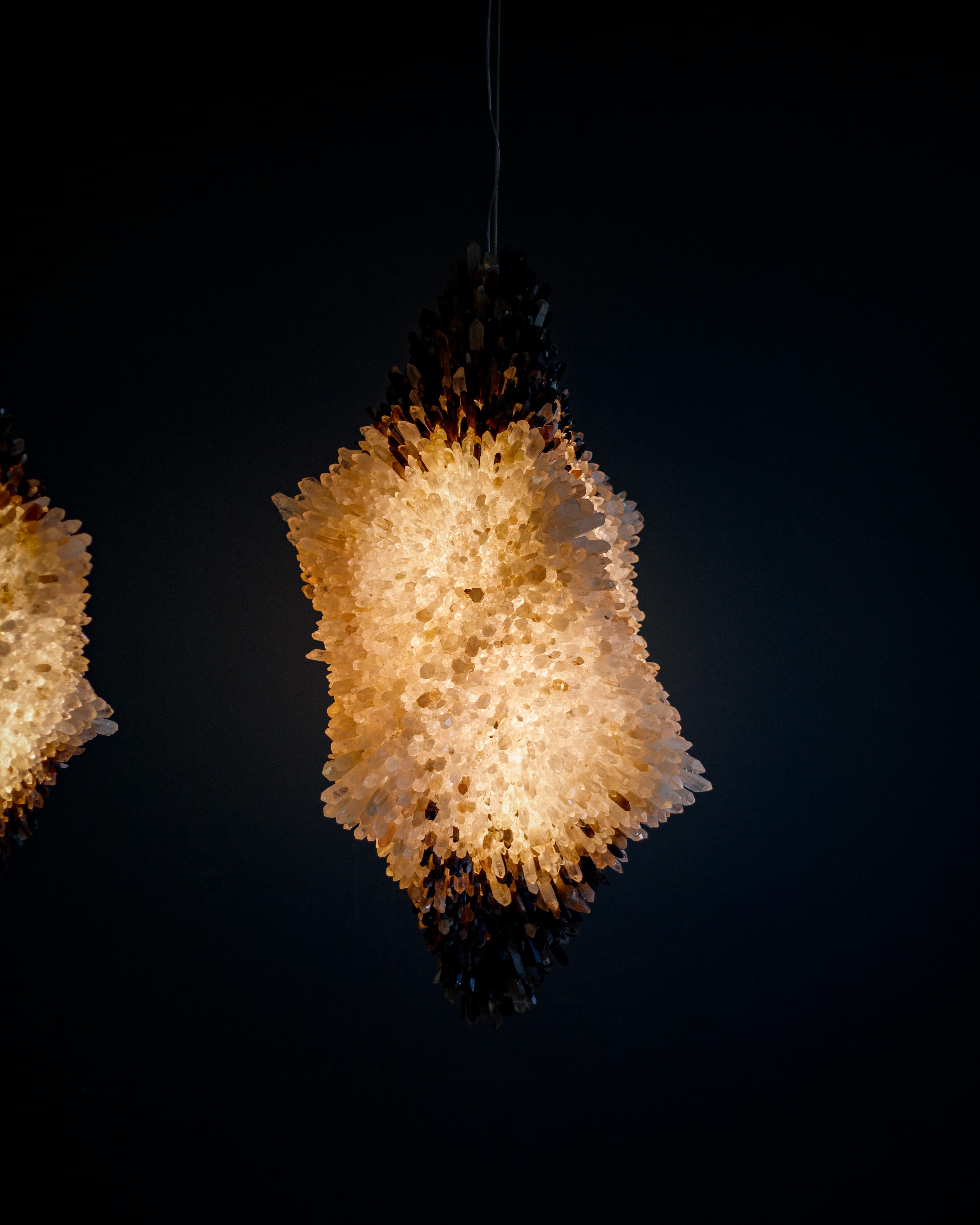 Large Goliath Pendant Light by Christopher Boots
Dimensions: D 65 x W 75 x H 135 cm.
Materials: Clear quartz, smoky quartz.

Available in medium or large. Please contact us.

In the ancient allegory, David triumphs over the giant Goliath using only