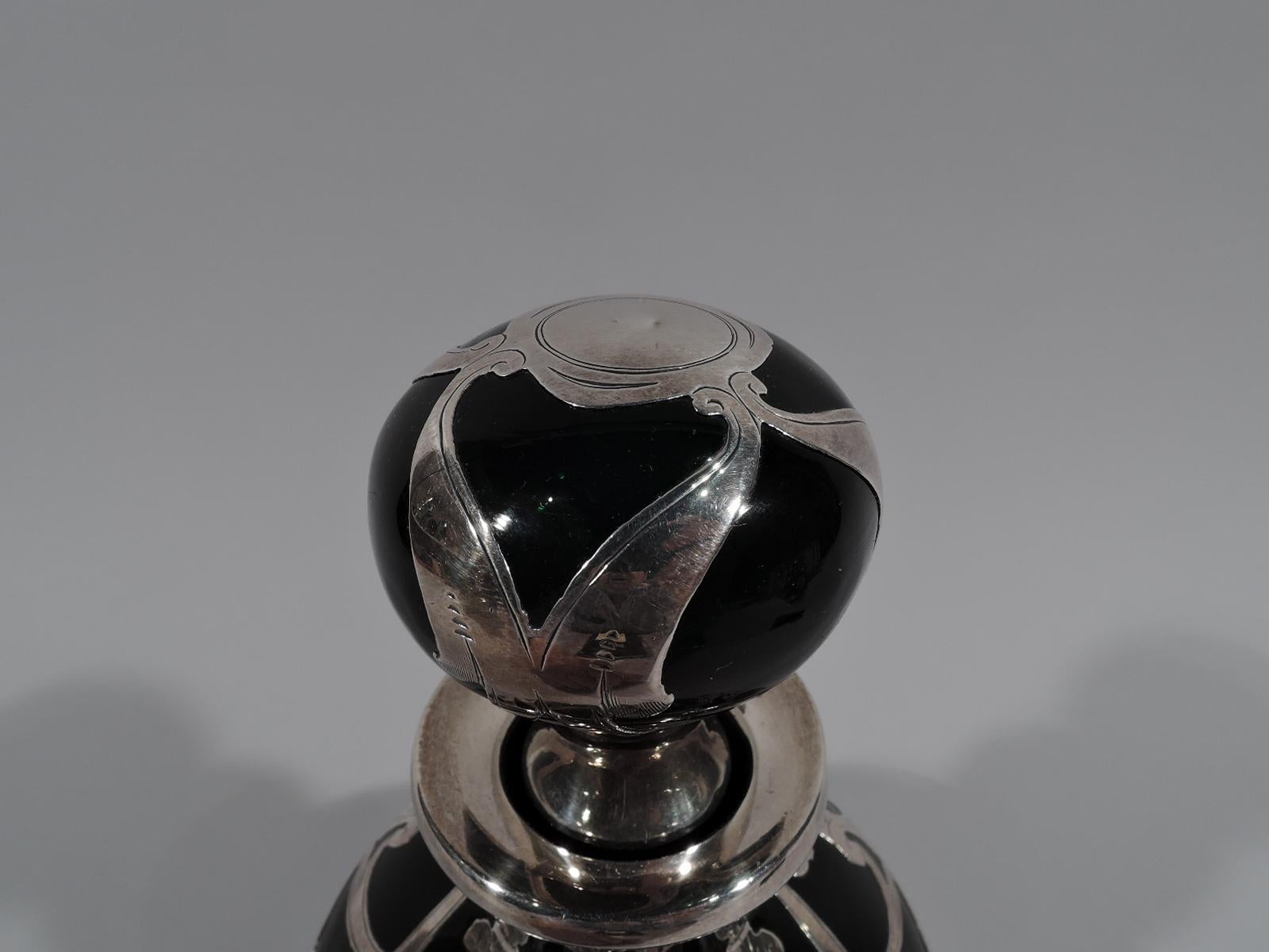 black and silver cologne bottle