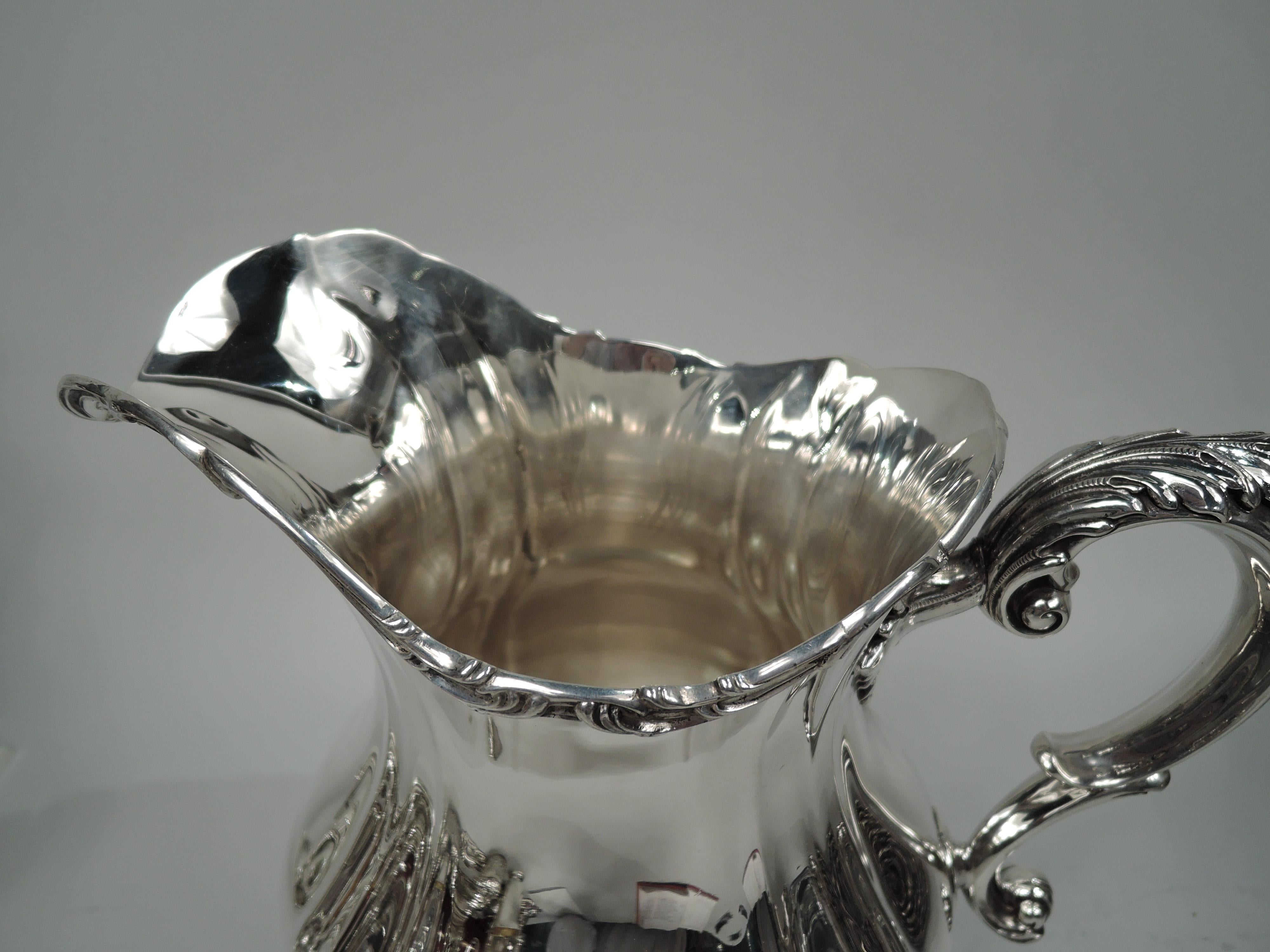 antique silver water pitcher