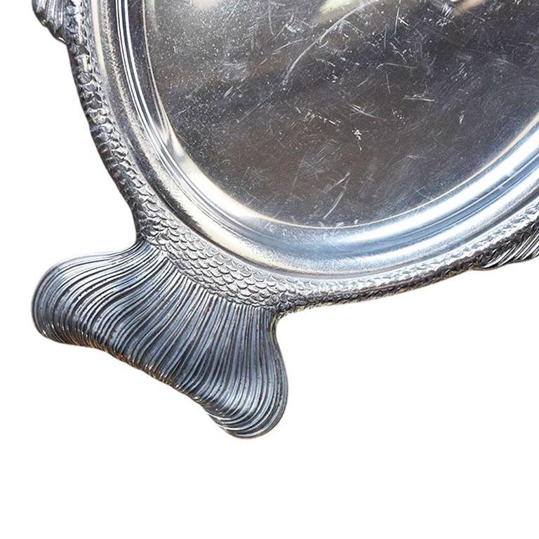 A large aluminum silver fish motif tray by Gorham. The bottom is marked Gorham YA 105.

Dimensions:
19.5