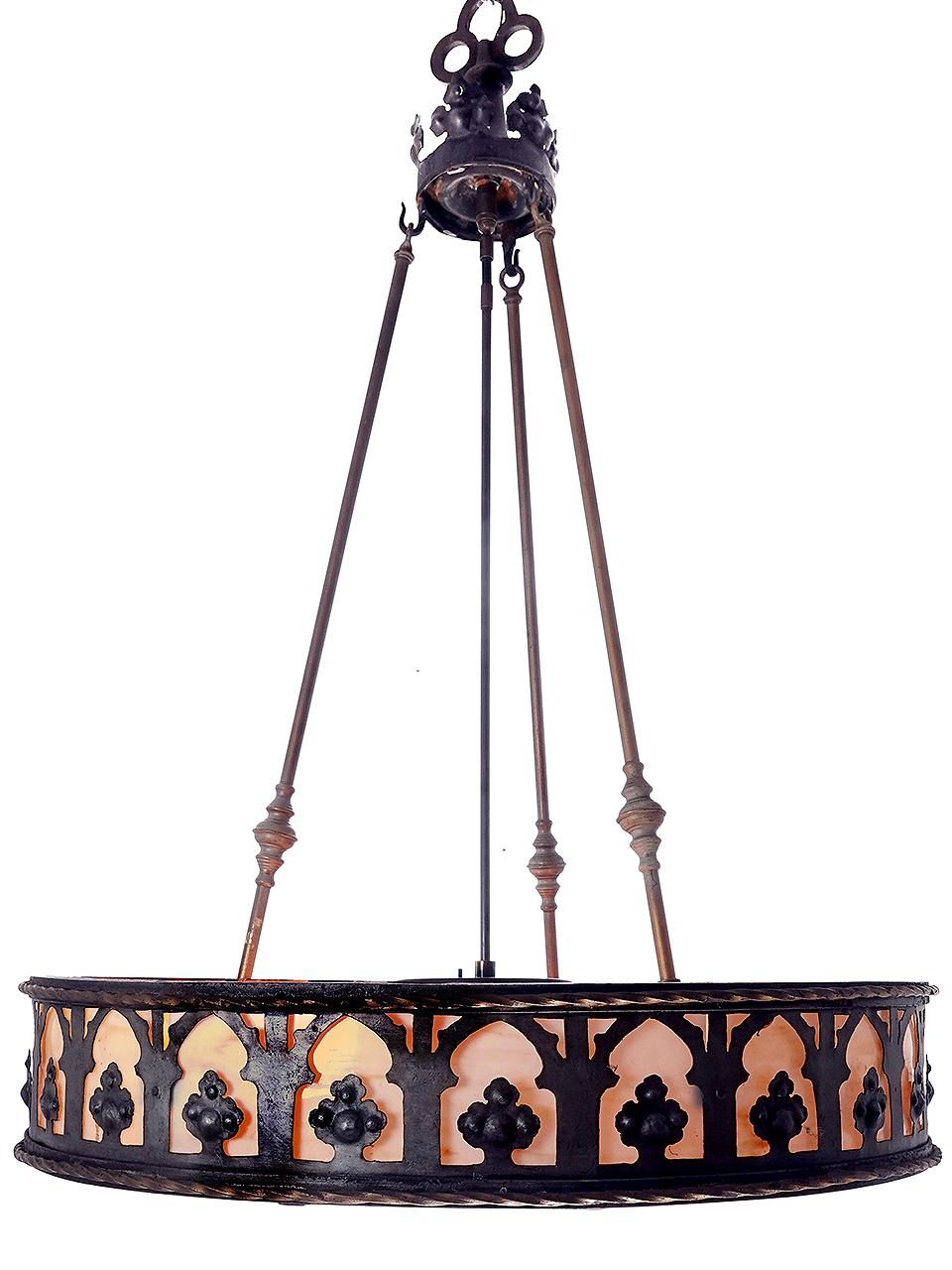 With a diameter of over 32 inches this is a very impressive lamp. its mostly iron and slump stained glass in a cream/amber color. The chandeliers most unique feature are the 7 round spotlight grills that fill the bottom. Each grill lifts off to