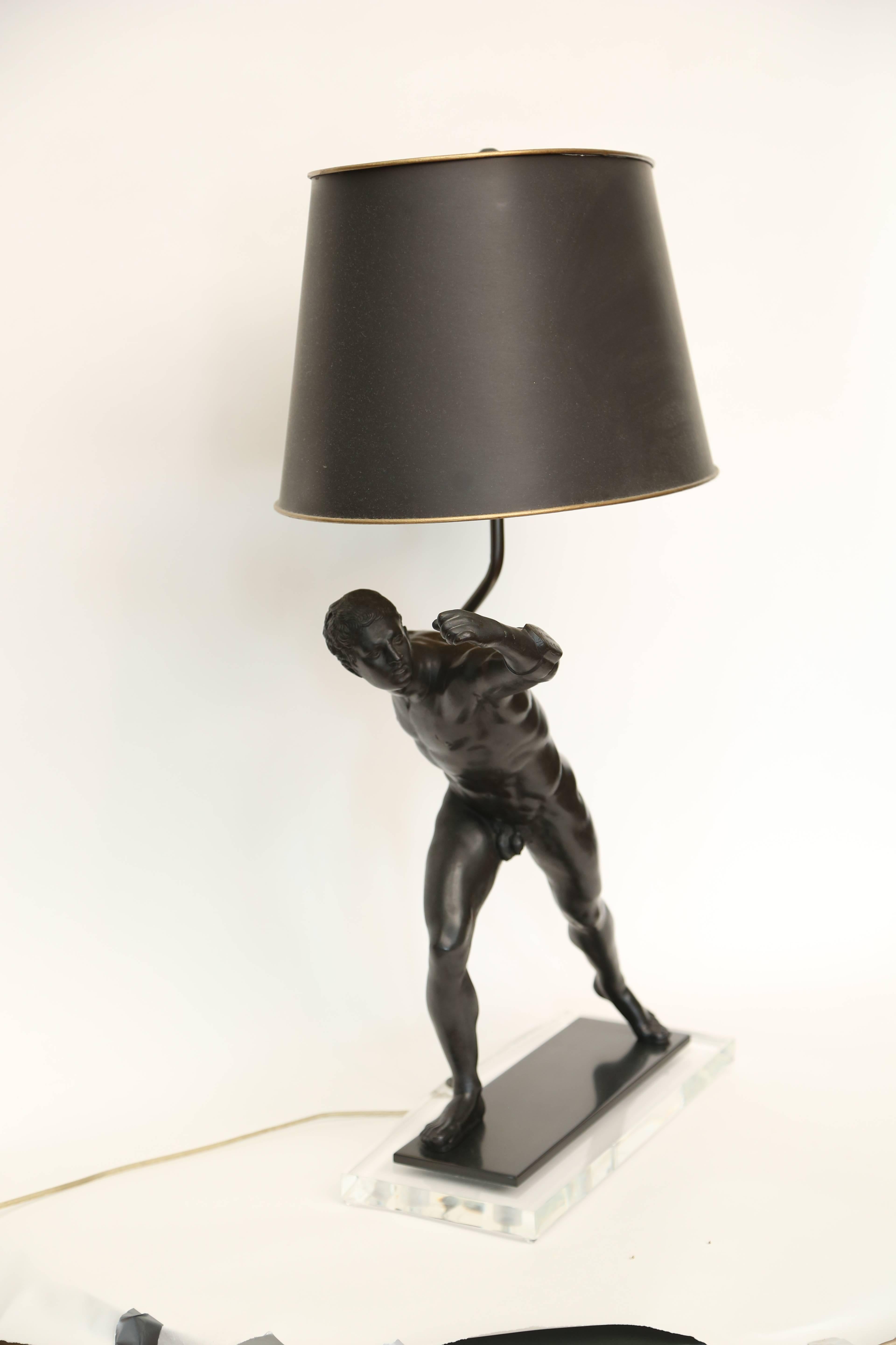Carved wood sculpture expertly painted to look like bronze and later mounted as a lamp. Inscribed CVQPC / McVCMC / SPCCN. Mounted on a Lucite base. Figure itself measures 17 1/8