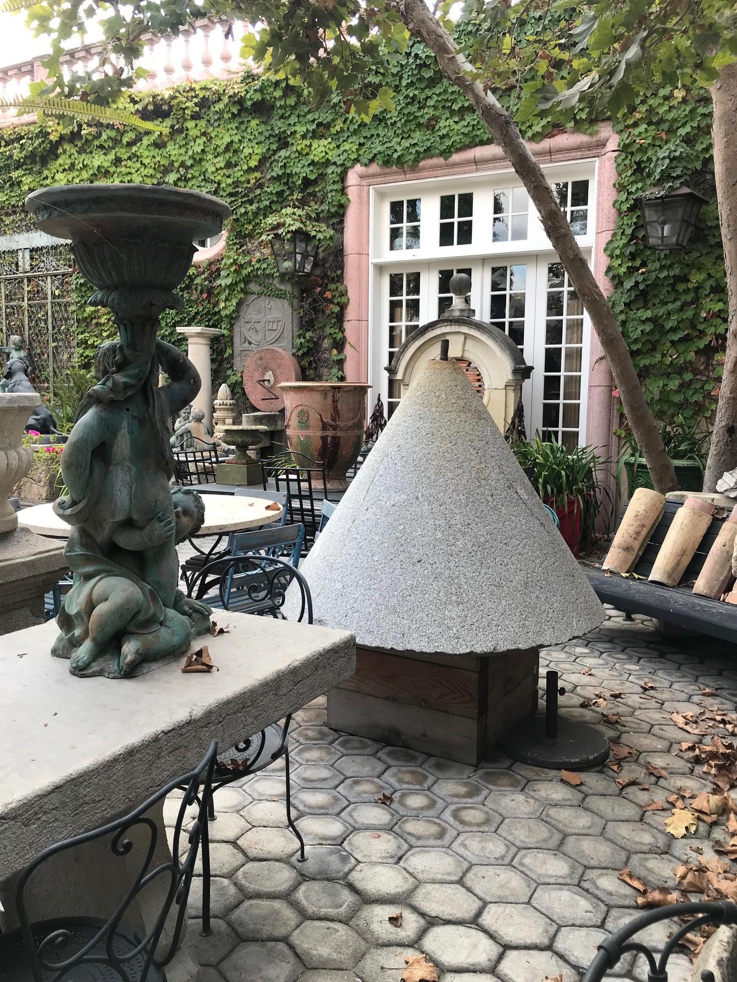 Very Large historic Olive press granite cone weighs approximately about 6000 Lbs each . 19th Century from Spain Cataluña . We have a total of 3 Cones architectural elements huge olive press from spain 
From side to side it’s 139” basin width if
