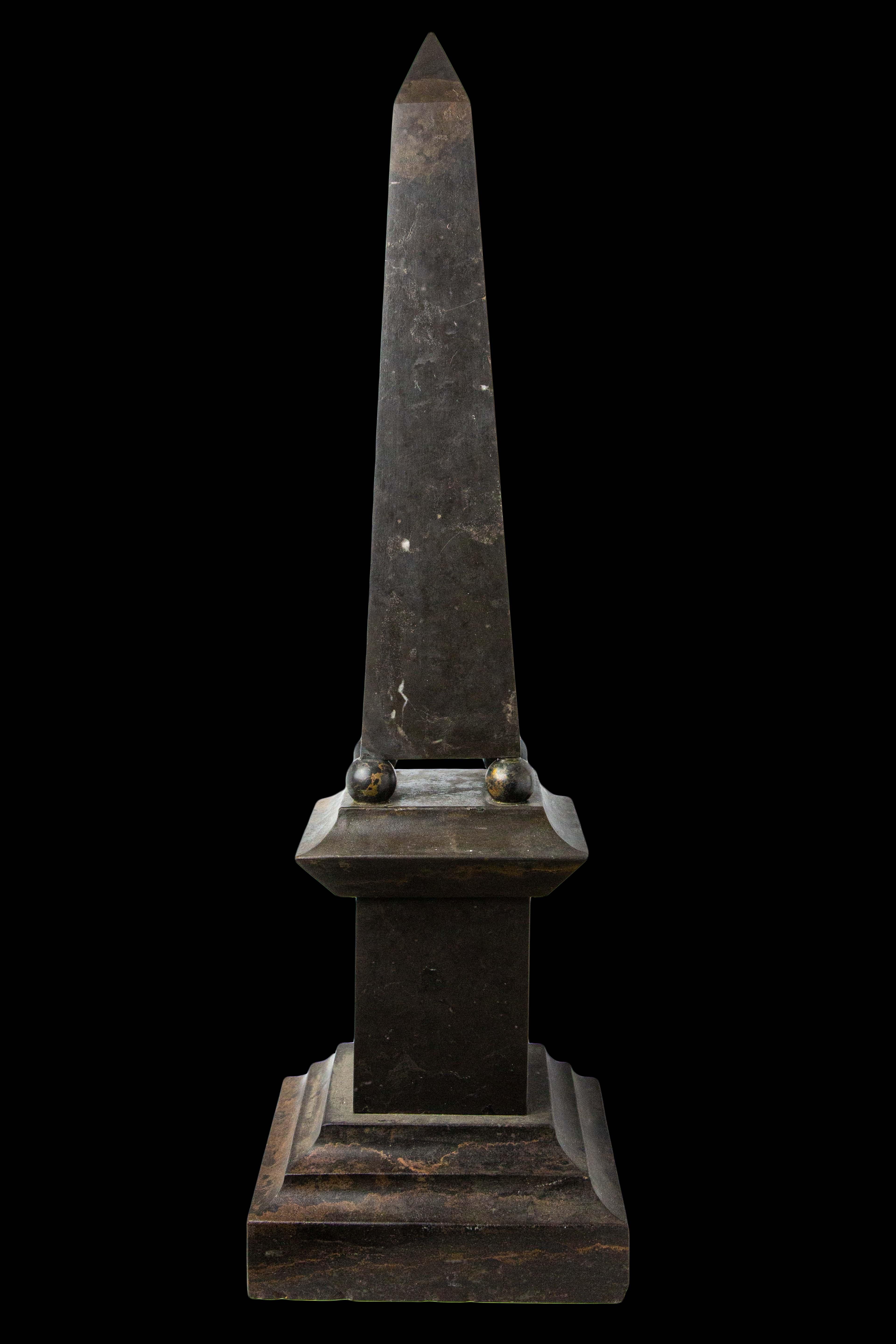Large Stone and Metal Obelisk:

Measures: 8.5