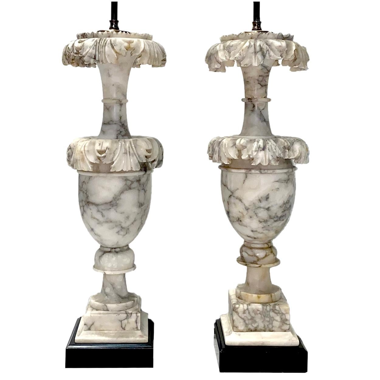 Pair of circa 1920s Italian carved gray alabaster lamps with dark veining and foliage motif on body as well as square pedestal bases.

Measurements:
Height of body 22