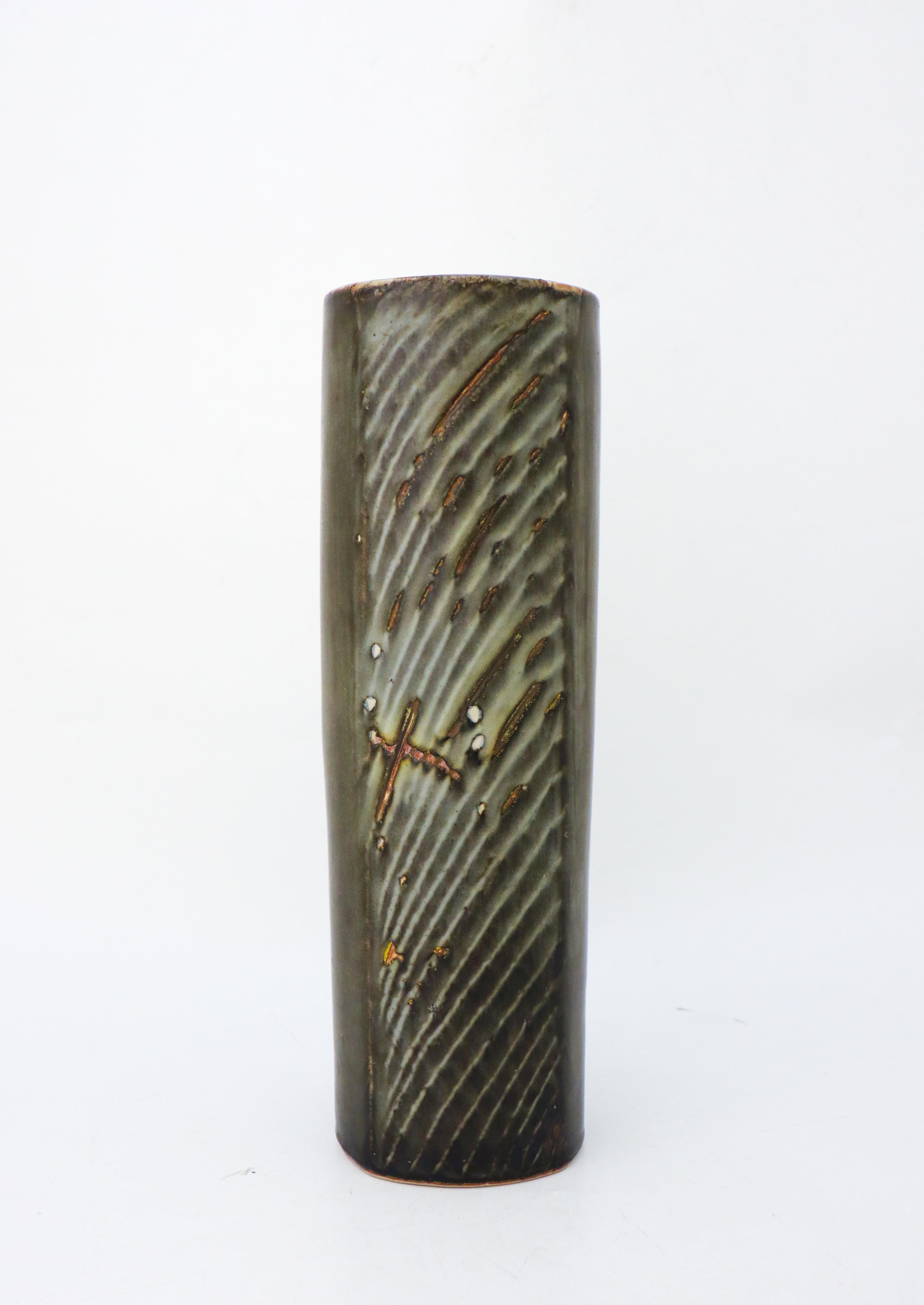 A large, gray cylindric vase designed by Carl-Harry Stålhane at Rörstrand Atelier, it´s 32,5 cm (13