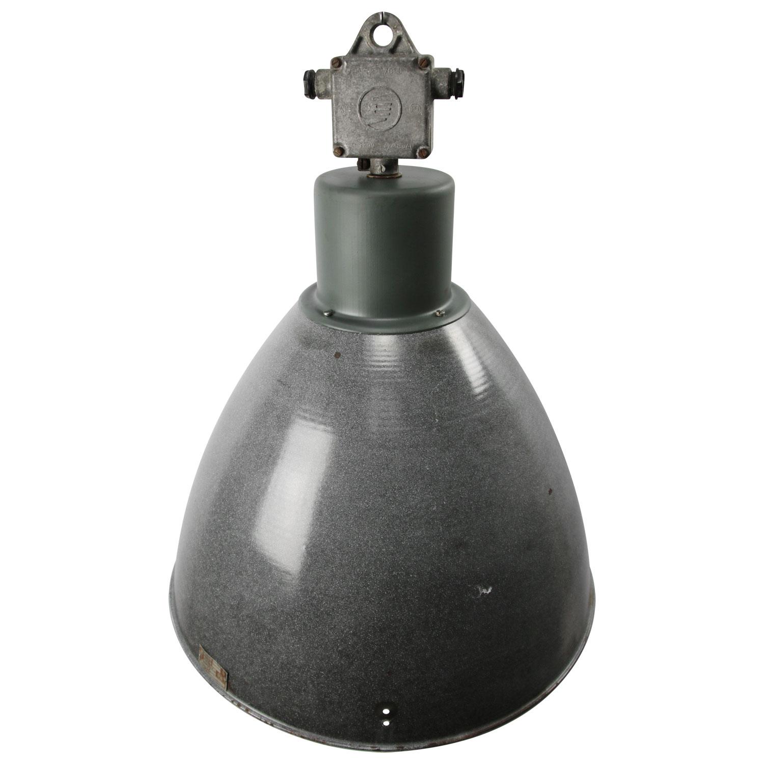 Industrial hanging lamp, dark gray enamel with white interior.
Cast aluminum top. 

Weight: 5.30 kg / 11.7 lb

Priced per individual item. All lamps have been made suitable by international standards for incandescent light bulbs,