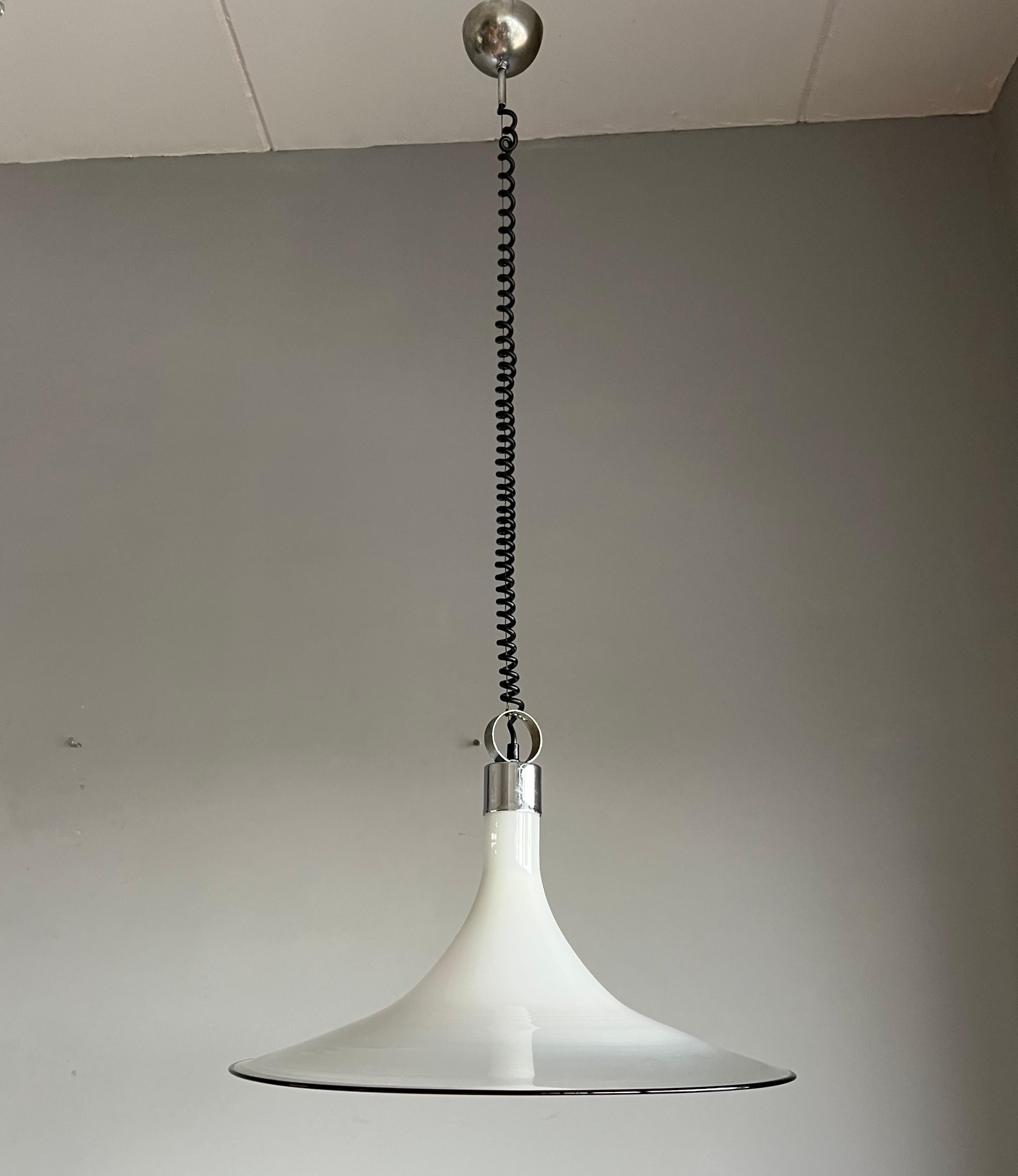 Wonderful Midcentury chandelier.

If you are looking for a rare and stylish mid-20th century fixture to grace your home or work space then this handcrafted Italian light could be perfect. One person might see an upside down vortex of liquid glass
