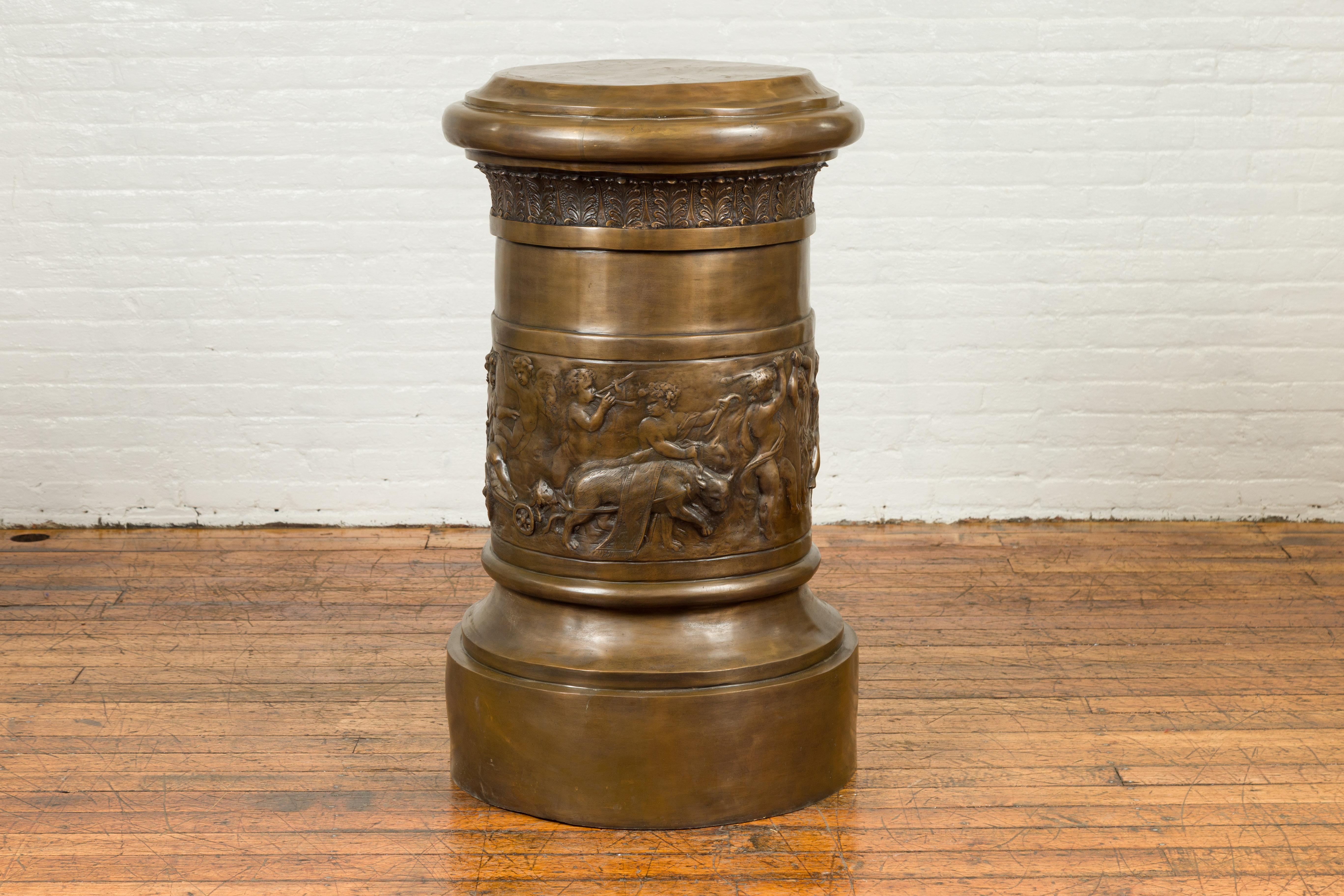A large Greco-Roman style contemporary bronze pedestal base depicting a Bacchanalia. Created with the traditional technique of the lost-wax (à la cire perdue) that allows a great precision and finesse in the details, this Greco-Roman inspired bronze