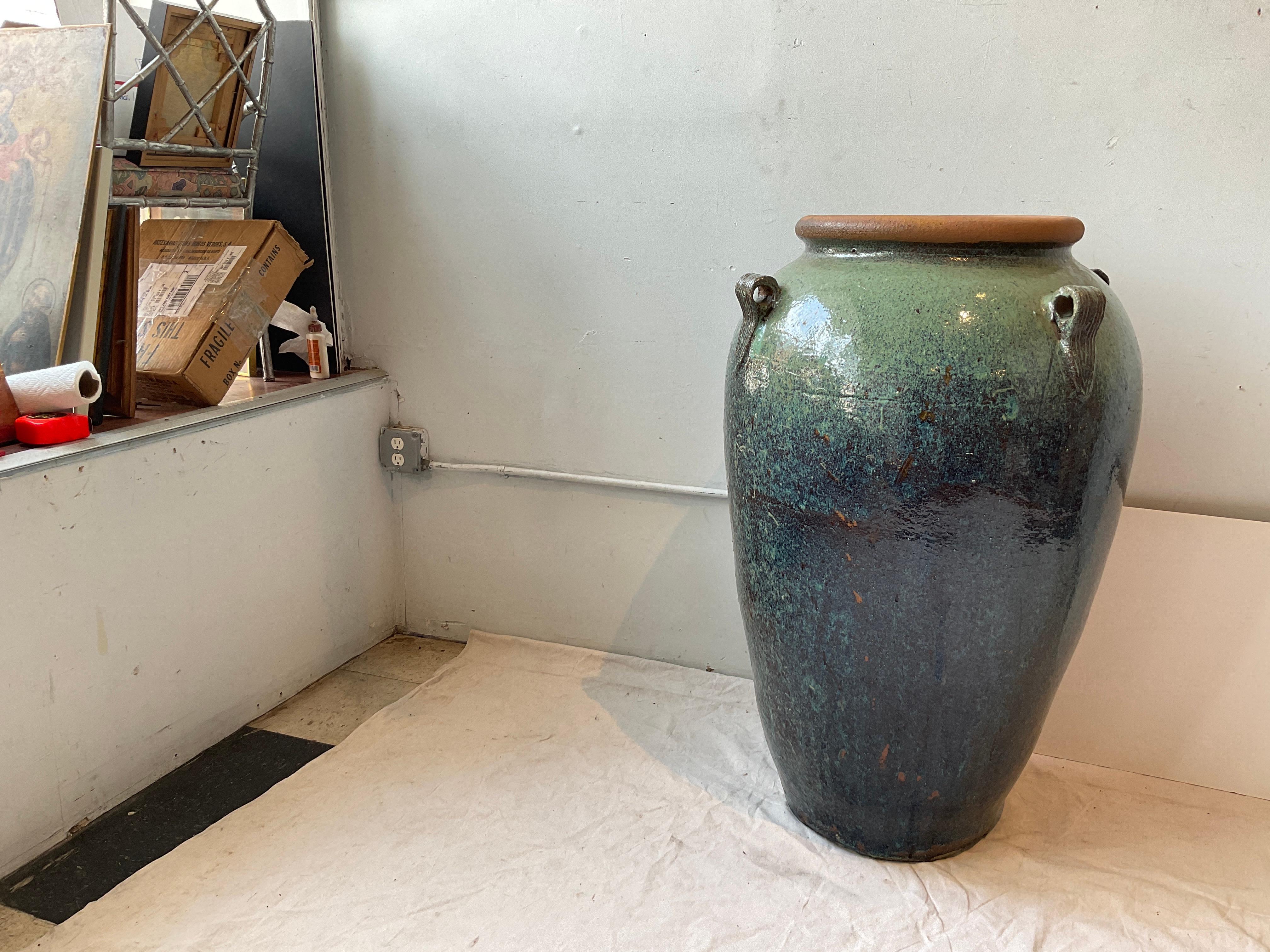 Large terracotta glazed urn.