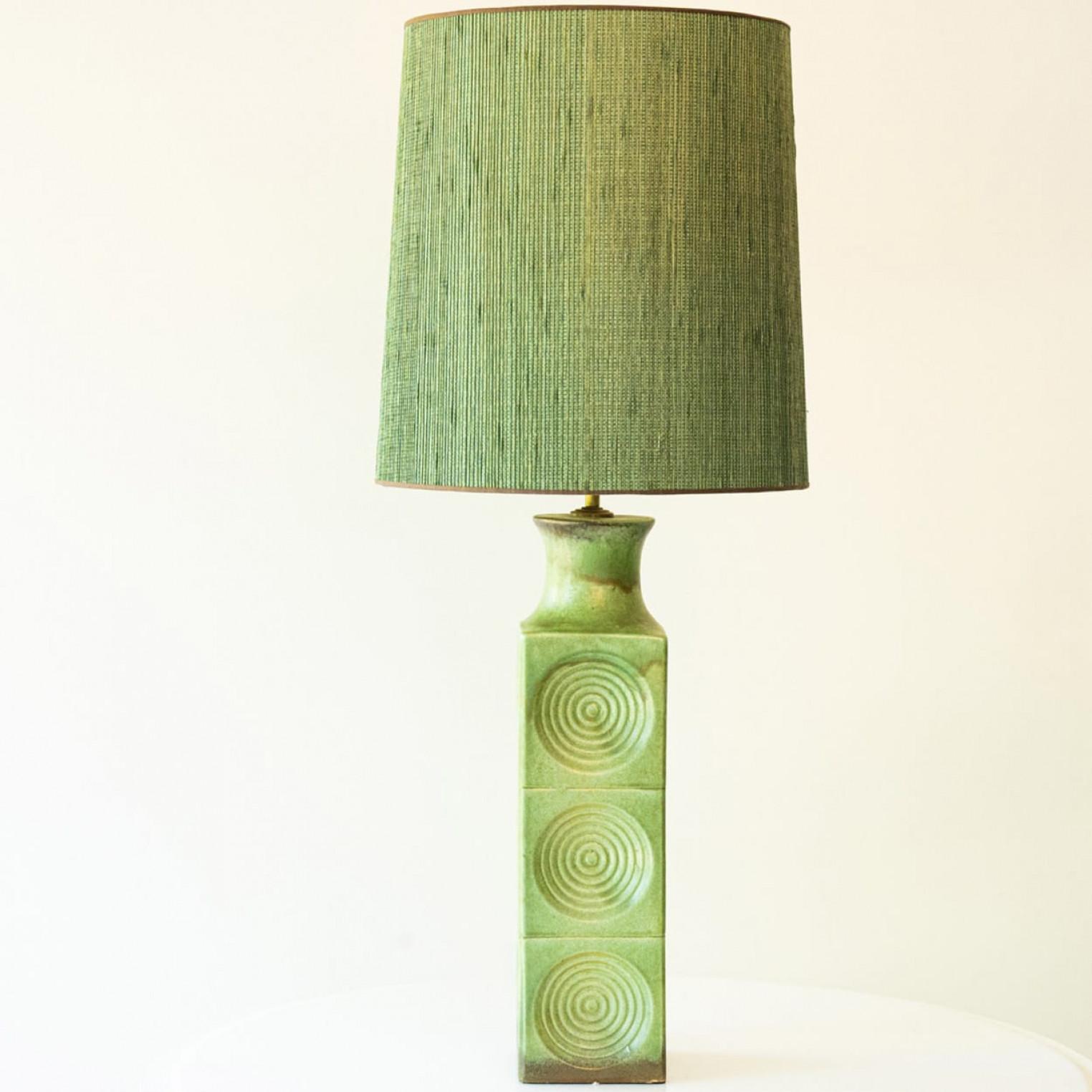 Beautifu large green colored ceramic table or foor lamp  from the 70s.

This ceramic lamp base brings refined elegance and rich visual appeal to any interior. With its sculptural shape and deep, expressive color, it showcases the enduring beauty of