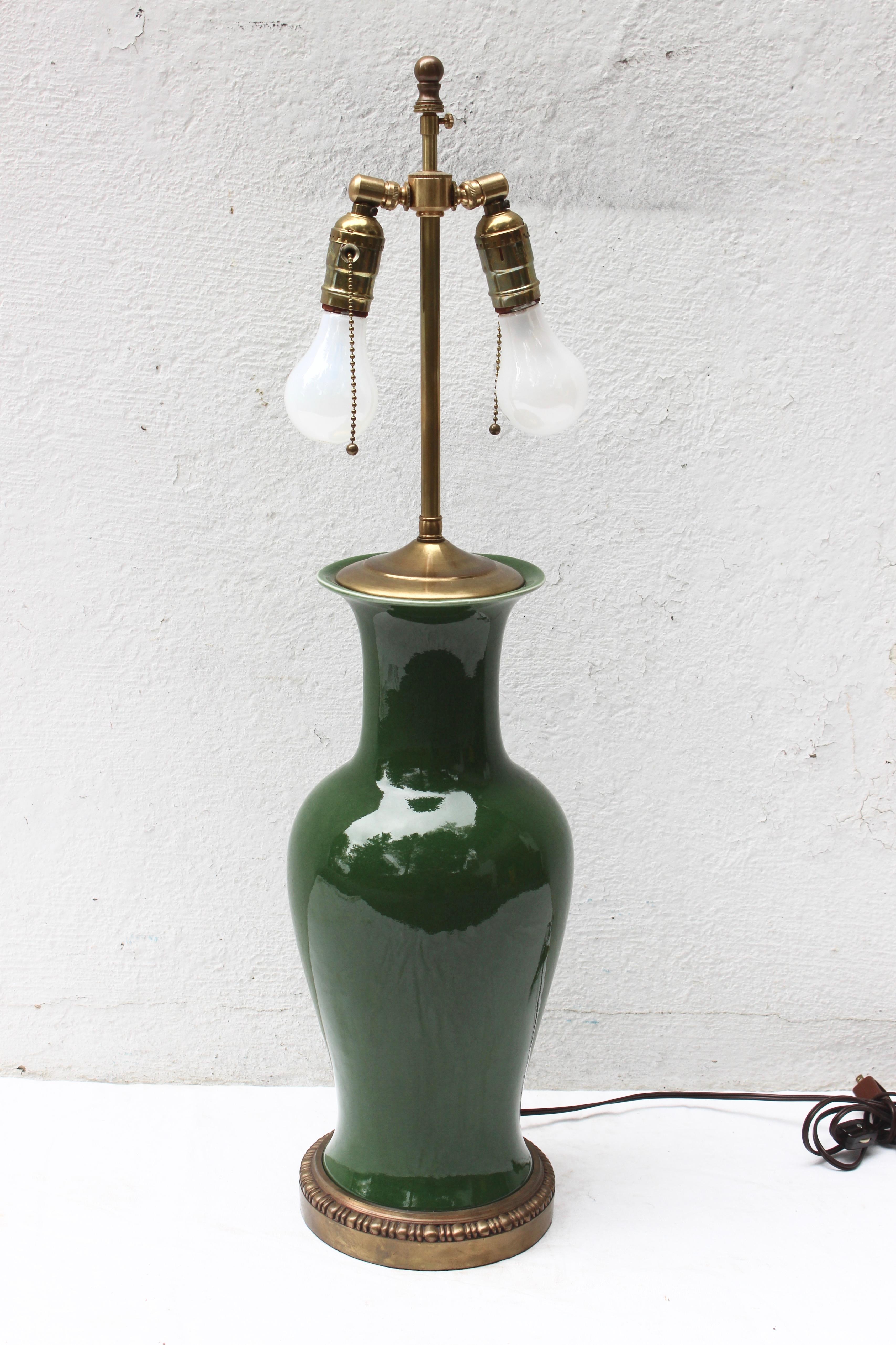 Large green ceramic table lamp with brass base

Lamp base: 29.5 