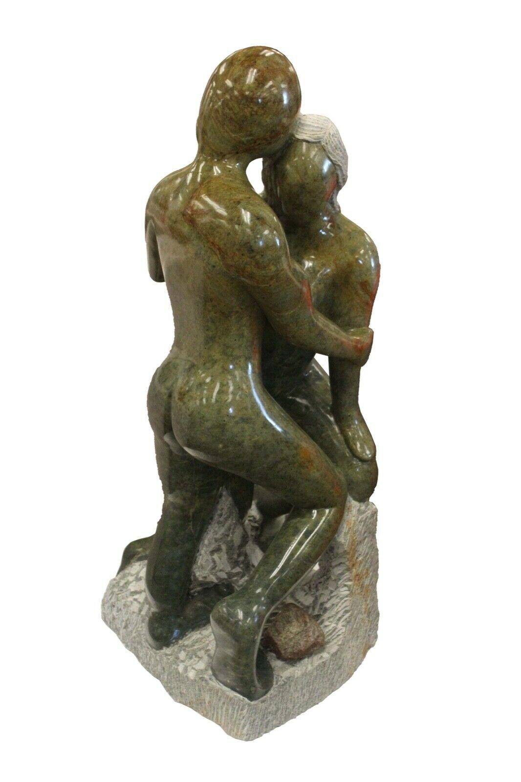 Incredibly large Soap Stone carving of two people hugging. Anatomically skilled artesian. Great use of stones
 natural coloration lending to the overall esthetics. Great use of both highly polished and texturized surfaces.
Sculptor created this