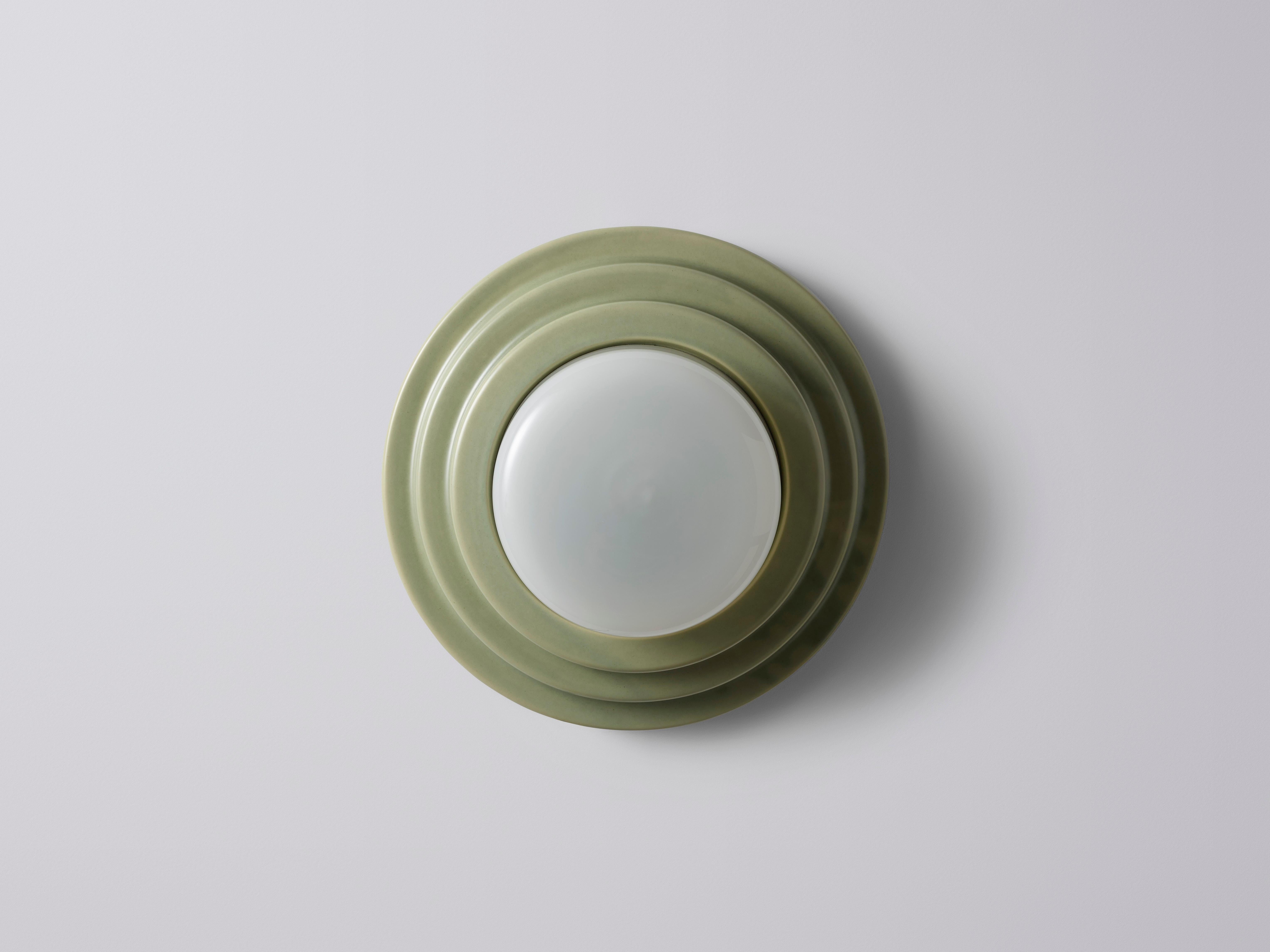 Large Green Honey Wall Sconce by Coco Flip
Dimensions: D 30 x W 30 x H 12 cm
Materials: Slip cast ceramic stoneware with blown glass. 
Weight: 4kg

Standard fixtures included
1 x ceramic G9 lamp holder
1 x dimmable 3.5W 3000K (warm white)
G9 LED