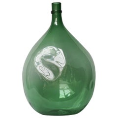 Grande bouteille verte italienne du 19e siècle en verre soufflé à la main avec "dent"
