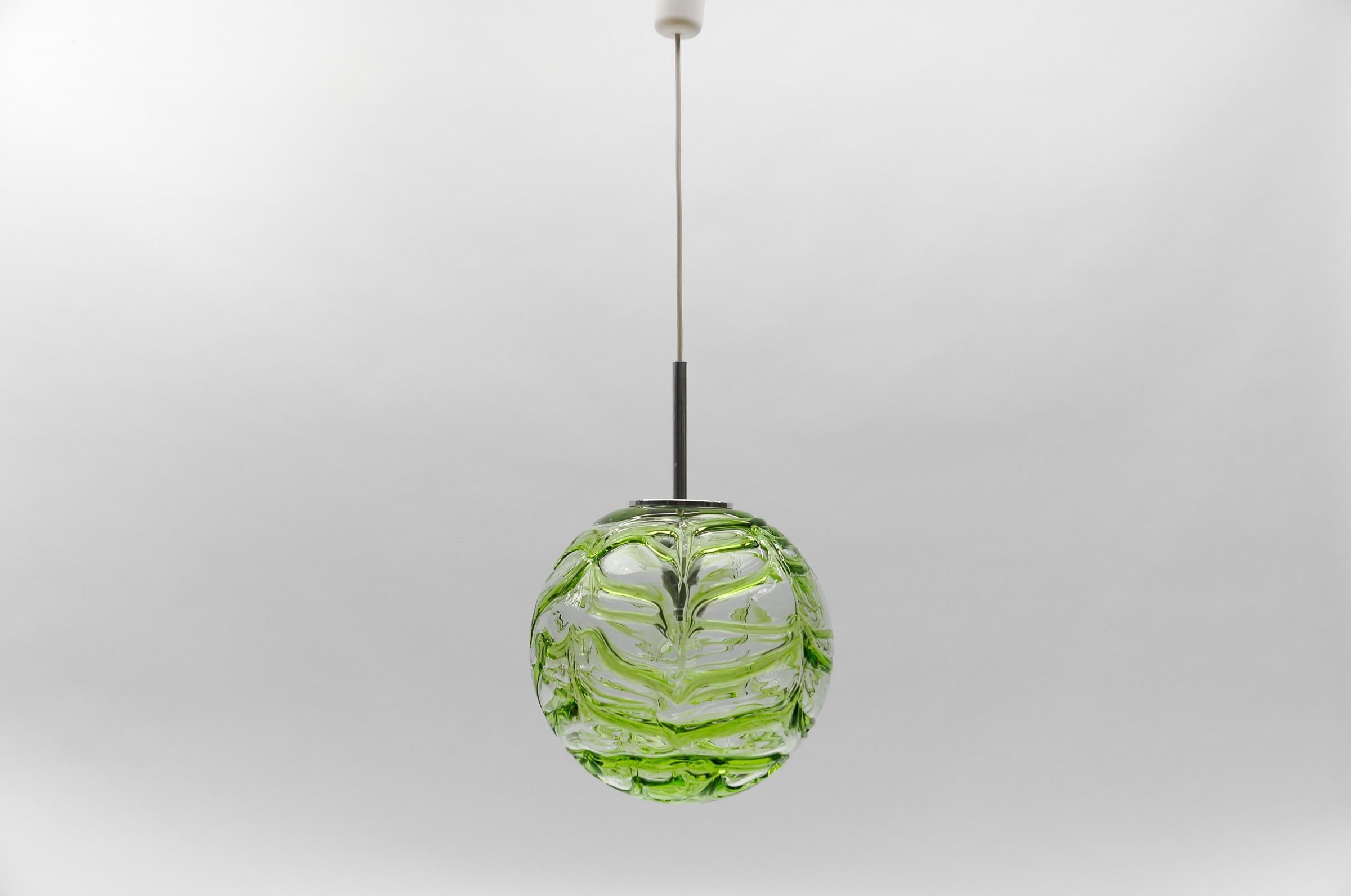 Large Green Murano Glass Ball Pendant Lamp by Doria, - 1960s Germany

One E27 socket. Works with 220V and 110V.

Our lamps are checked, cleaned and are suitable for use in the USA.