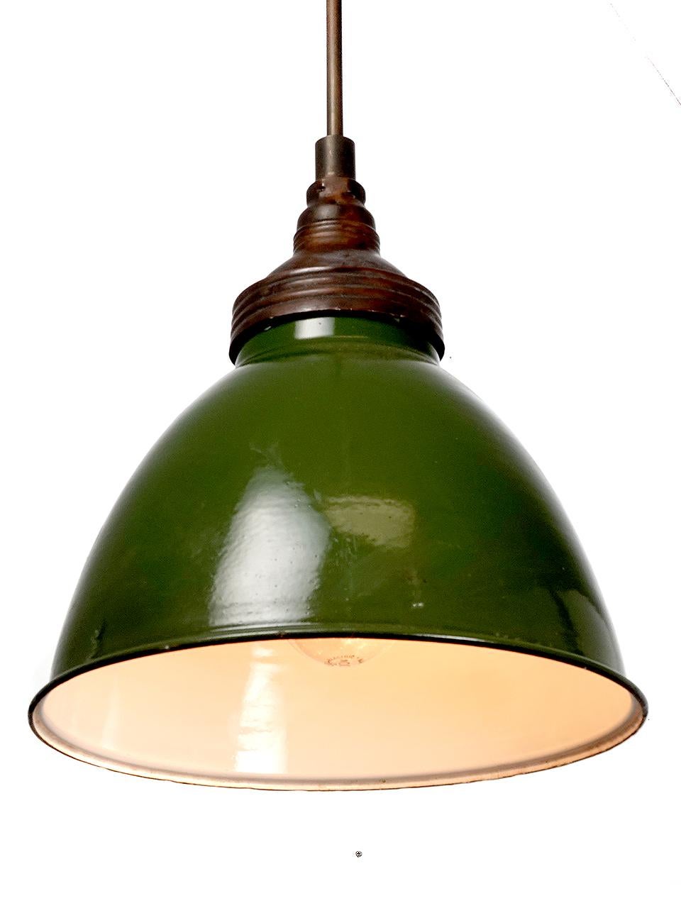 These and early simple large dome still feel contemporary after 75 years. The shade has a baked on finish with a small age or wear mark here and here. The top is dark copper and finish gives the dome its unique look. We have a few in stock and they