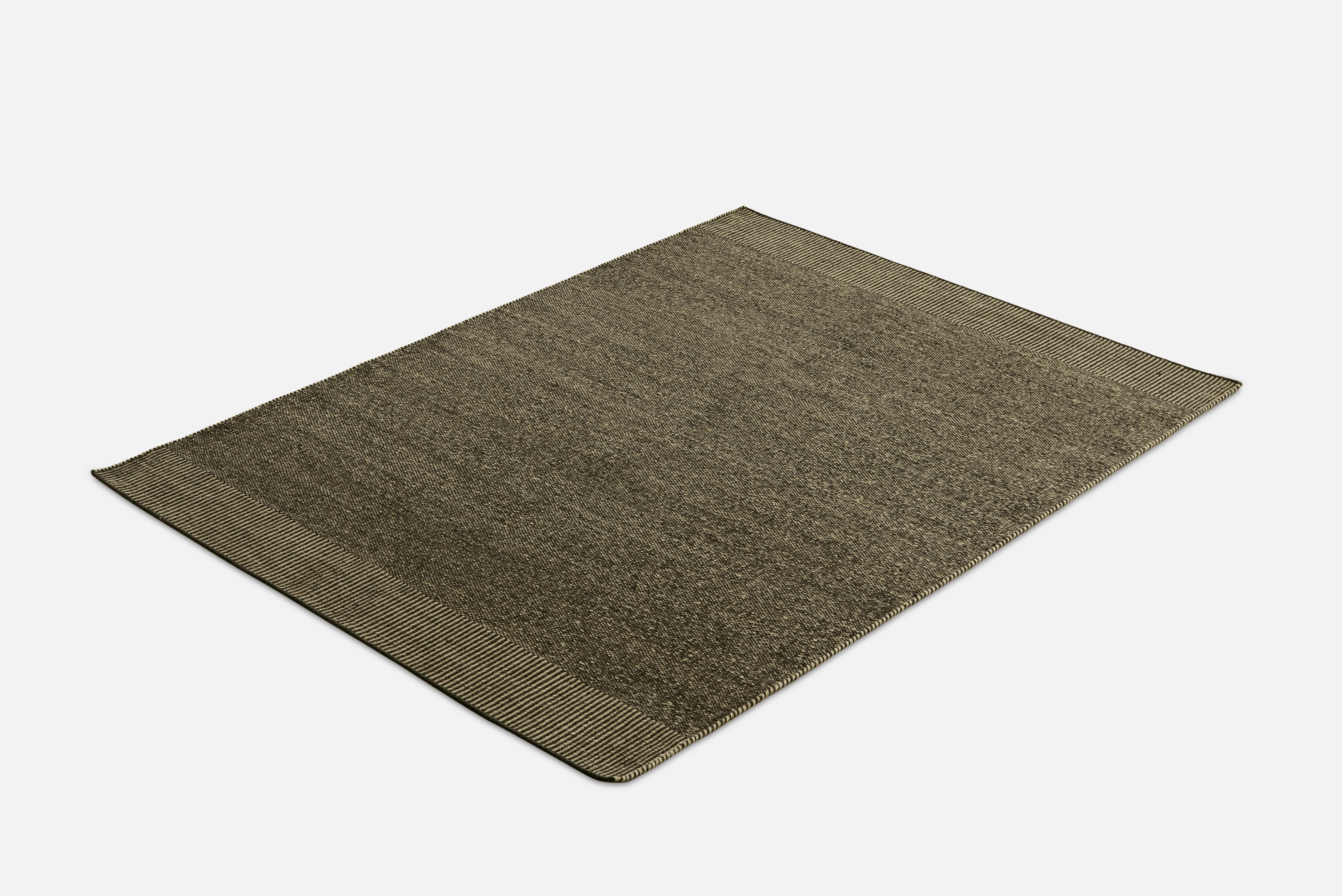Large green Rombo rug by Studio MLR
Materials: 65% wool, 35% jute.
Dimensions: W 170 x L 240 cm
Available in 3 sizes: W 90 x L 140, W 170 x L 240, W 75 x L 200 cm.
Available in grey, moss green and rust.

Rombo is characterised by the