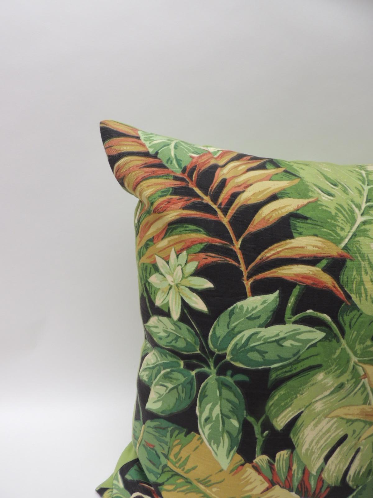 Tropical large bark cloth decorative floor pillow with textured vintage linen backing in acid green. Fabric depicting banana, palm and elephant ears foliage. In shades of green, orange, yellow on a dark black background. Palm Beach boho-chic.