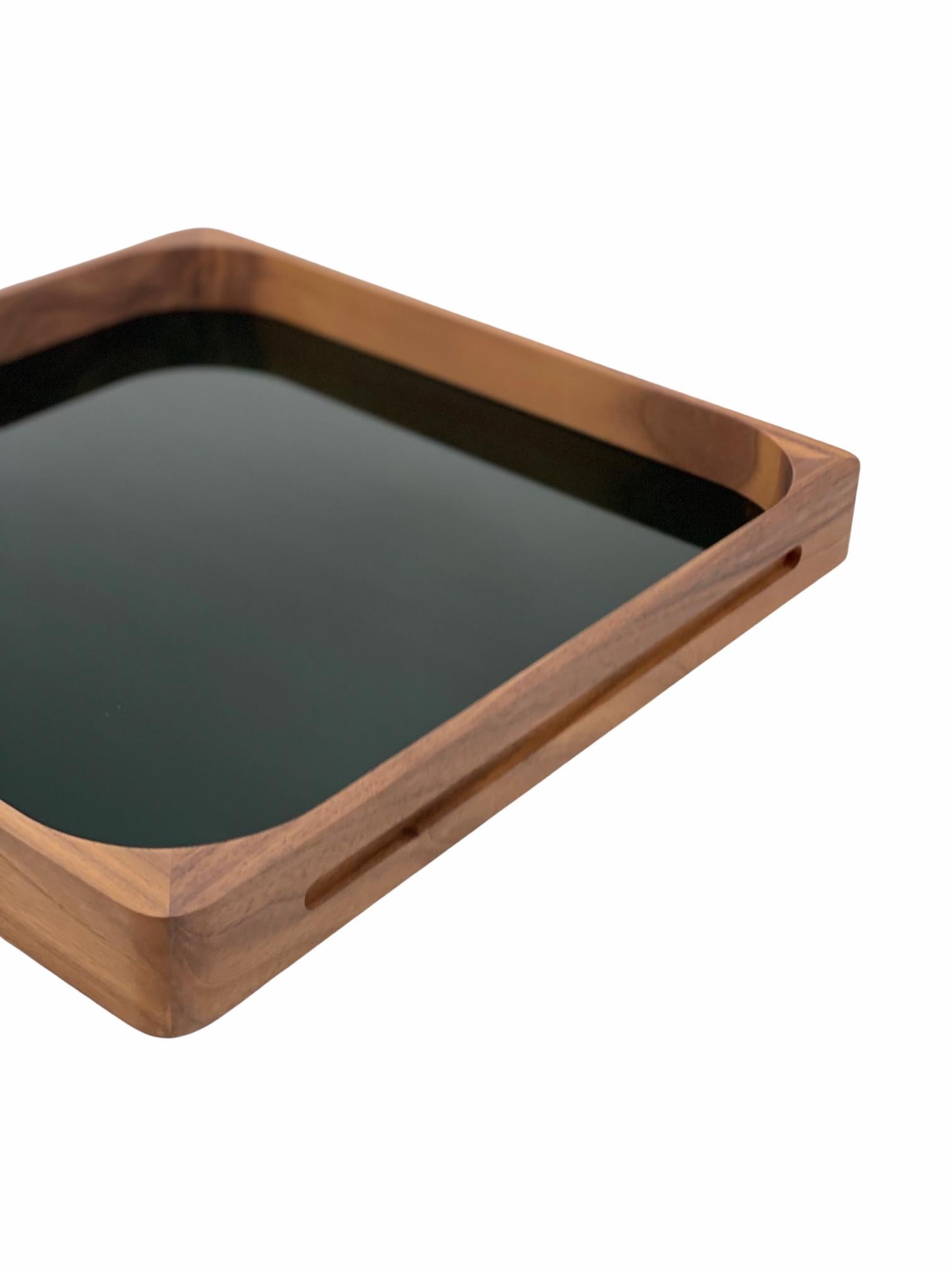This classic, yet modern, craftsmanship based tray is made out of walnut wood and acrylic and was designed by GS in 2004. It can be used by clients as a cocktail tray as well as a very modern and practical serving tray, making it the perfect gift.