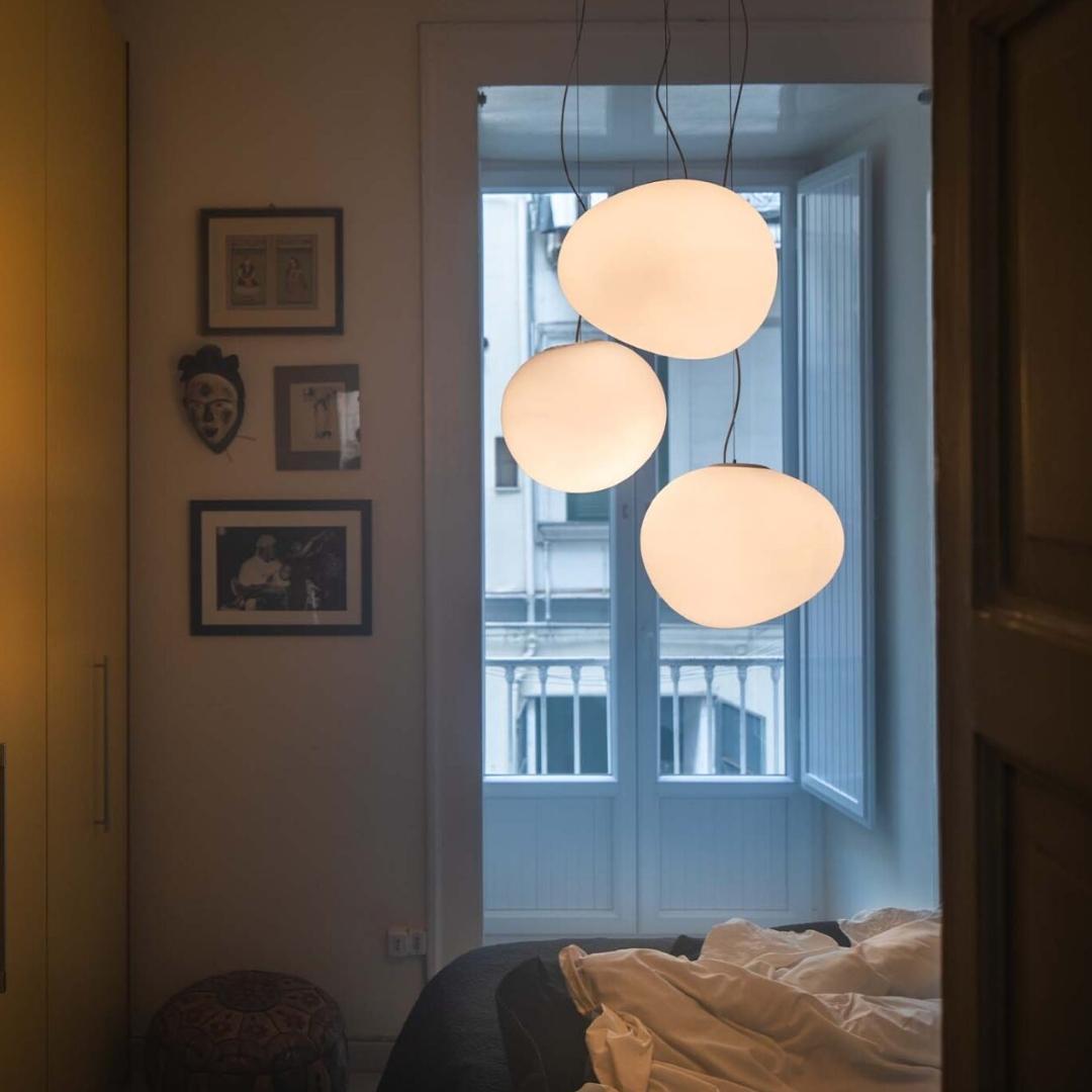 Large 'Gregg' Handblown Glass Pendant for Foscarini.

Inspired by the shape of a pebble honed and smoothed by running water or the egg of a mythological creature, the 'Gregg' series for Foscarini features lamps that change depending on the