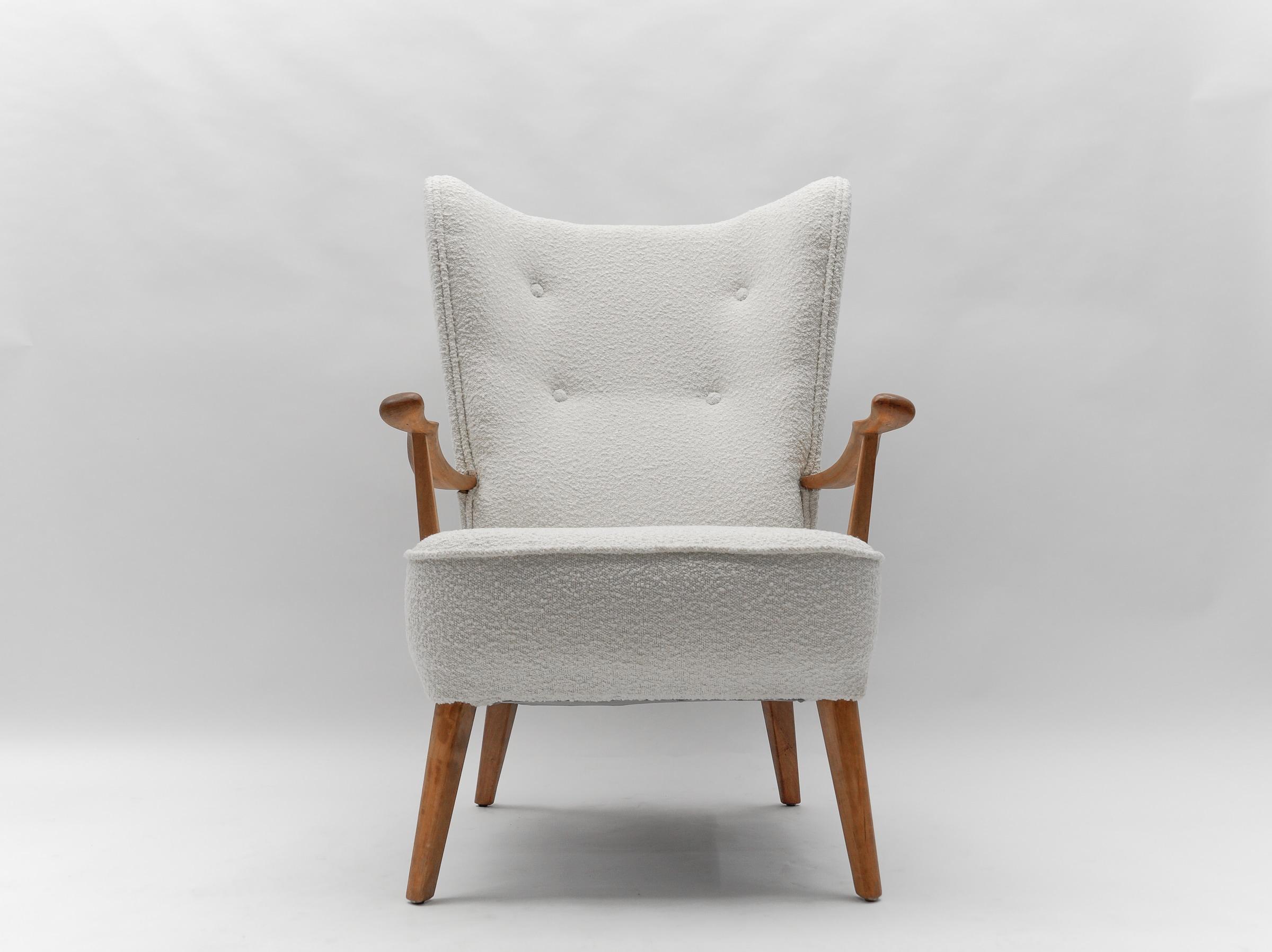 Awesome armchair.

New upholstery in white boucle fabric.
