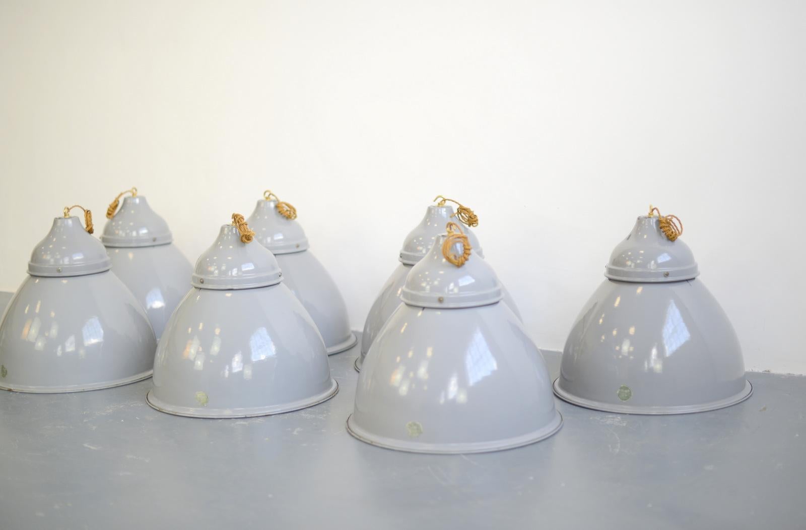 Large grey enamel Benjamin Factory lights circa 1950s V2

- Price is per lamp (23 available)
- Vitreous grey enamel bell shaped shades
- White enamel inner reflector with copper detail
- Takes E27 fitting bulbs
- Comes with 100 cm of cable and