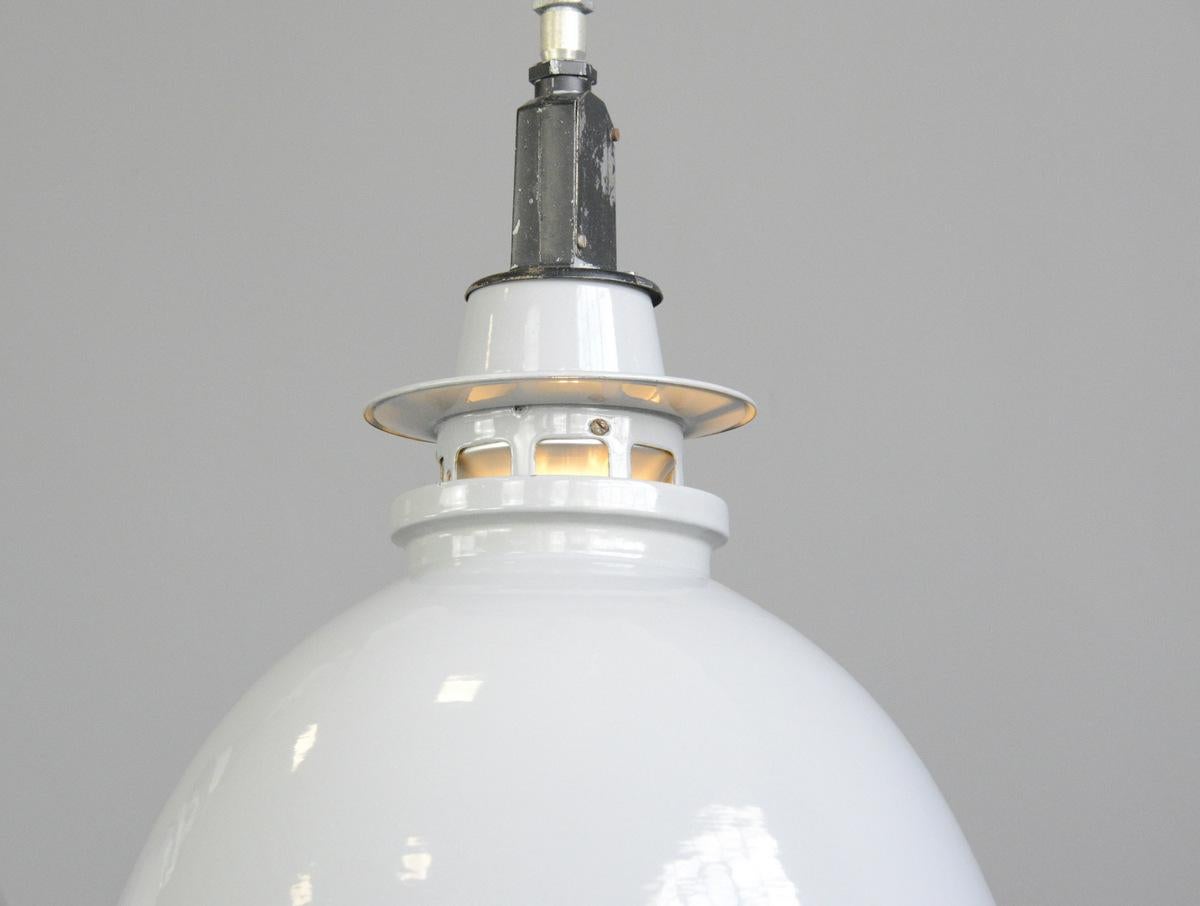 Large grey enamel factory lights by Thorlux circa 1950s

- Price is per light (2 available)
- Light grey vitreous enamel shades
- Twist off shades for easy cleaning
- Takes E27 fitting bulbs
- Comes with chain and ceiling hook
- Made by