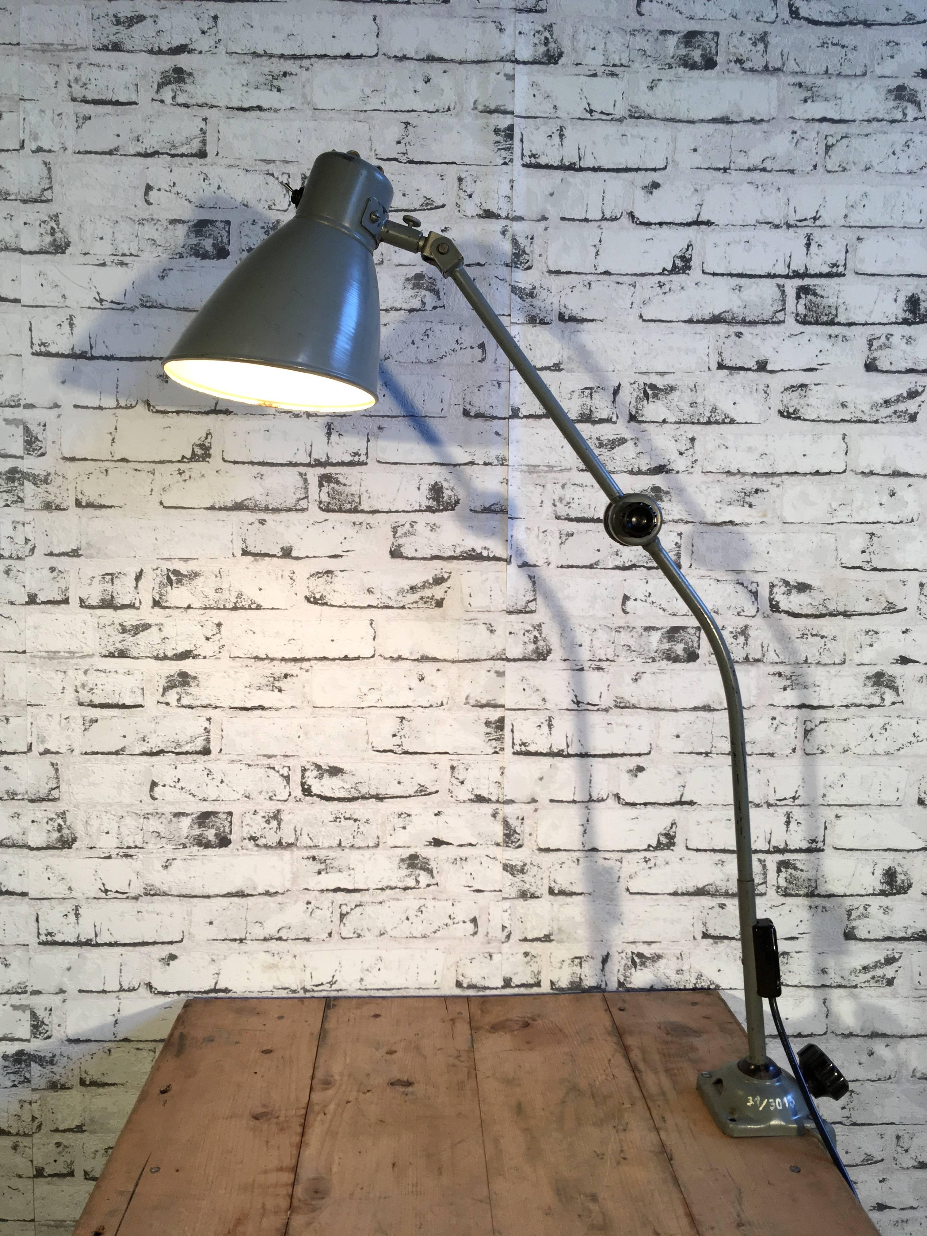 Large grey industrial table lamp with three adjustable joints. Switch is located directly on the lampshade. Lamp is fully functional and in good vintage condition. New socket E 27 and wire.
Measures: Height 80.0 cm
Depth 22.0 cm
Other diameter 17 cm.