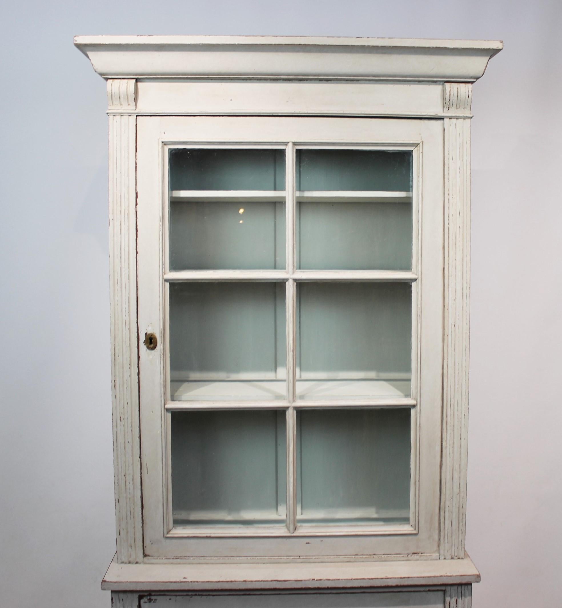 Large grey painted Gustavian glass cabinet from circa 1860s, in great antique condition.