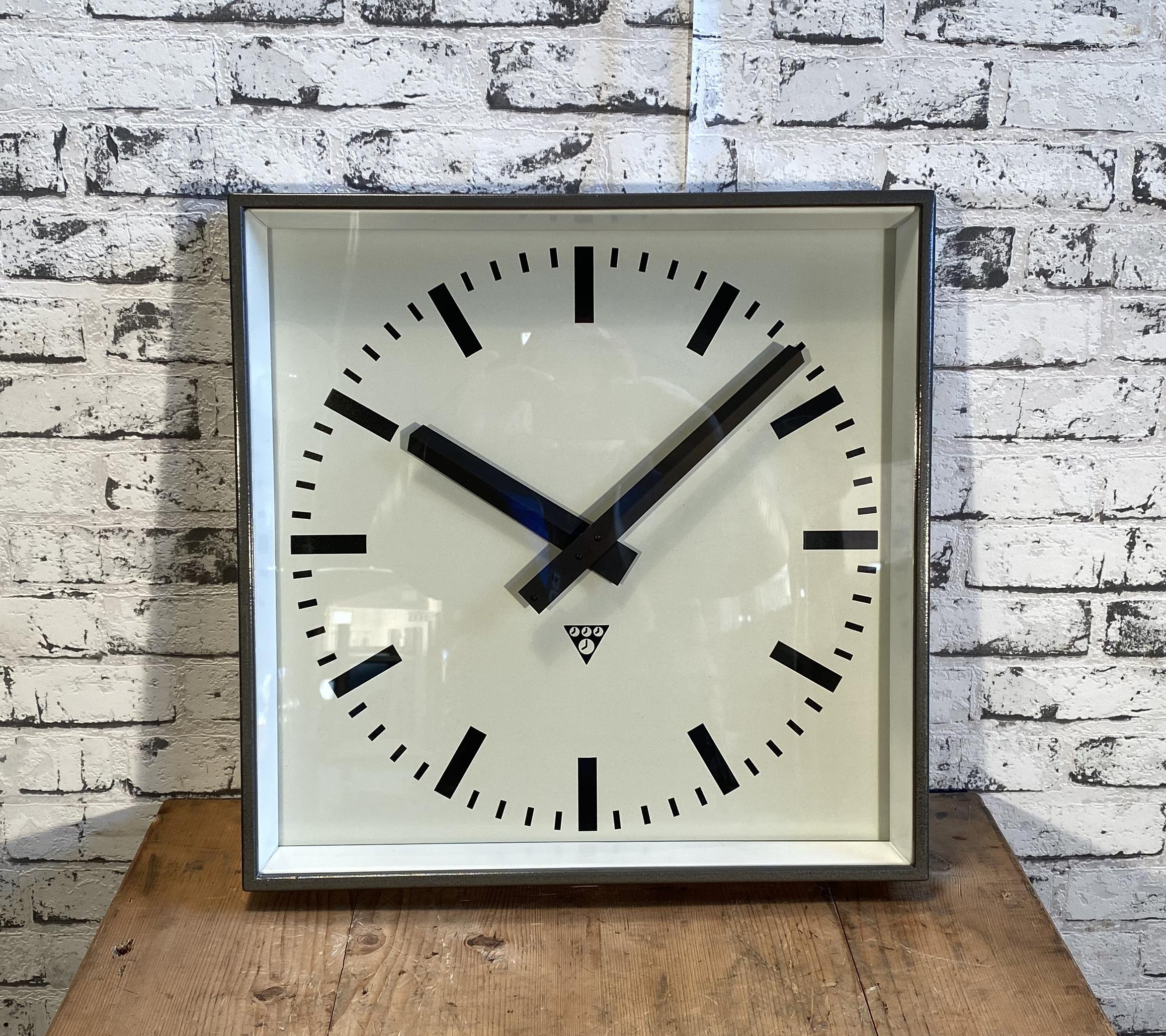 - Clock made by Pragotron in former Czechoslovakia in the 1960s
- Was used in factories, schools & railway stations
- Features a gray hammer finish metal body, aluminium dial, clear glass
- Has been converted into a battery-powered clockwork
-