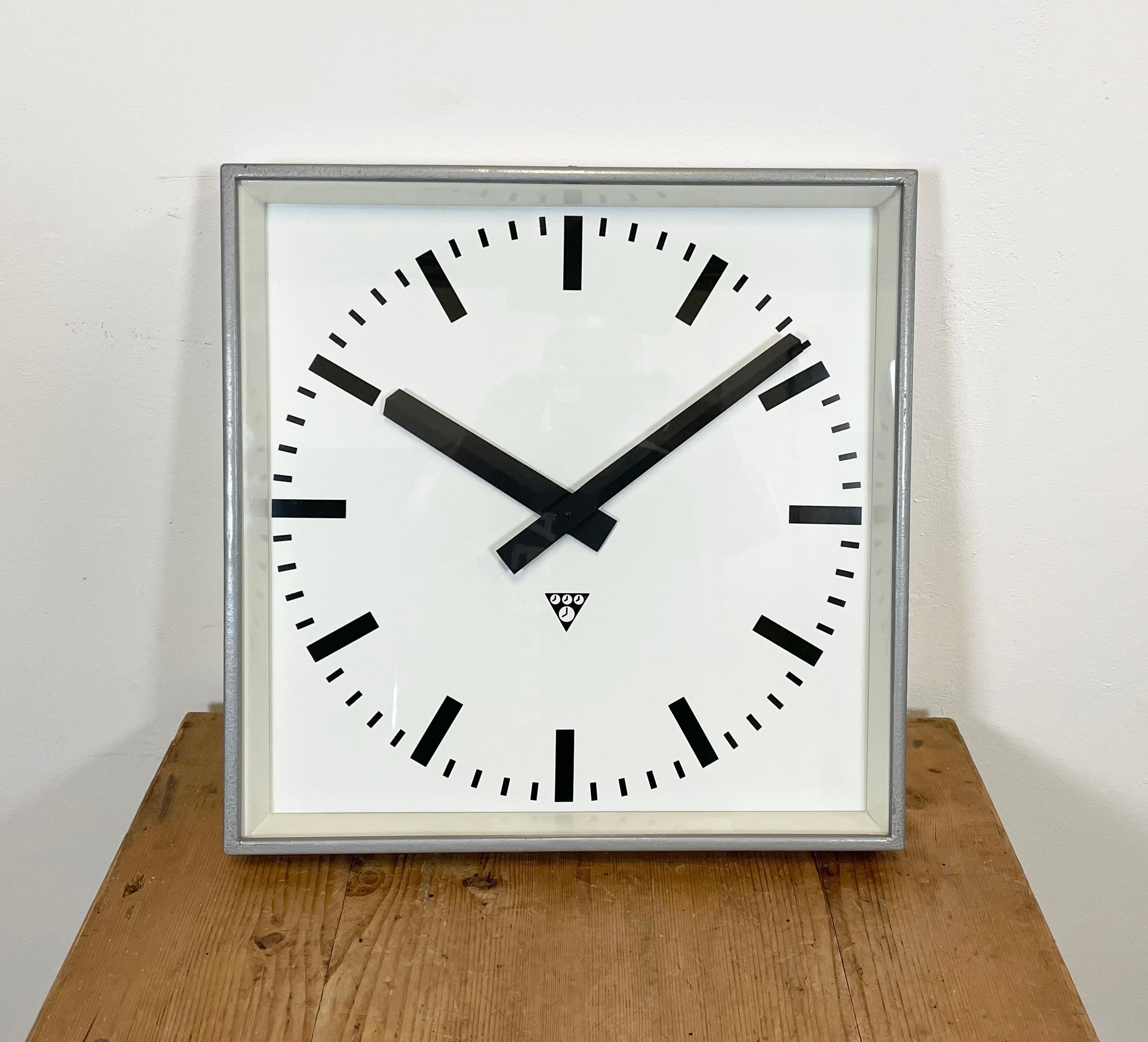 - Clock made by Pragotron in former Czechoslovakia during the 1960s
- Was used in factories, schools & railway stations
- Features a gray Hammer paint finish metal body, aluminum dial, clear glass
- Has been converted into a battery-powered