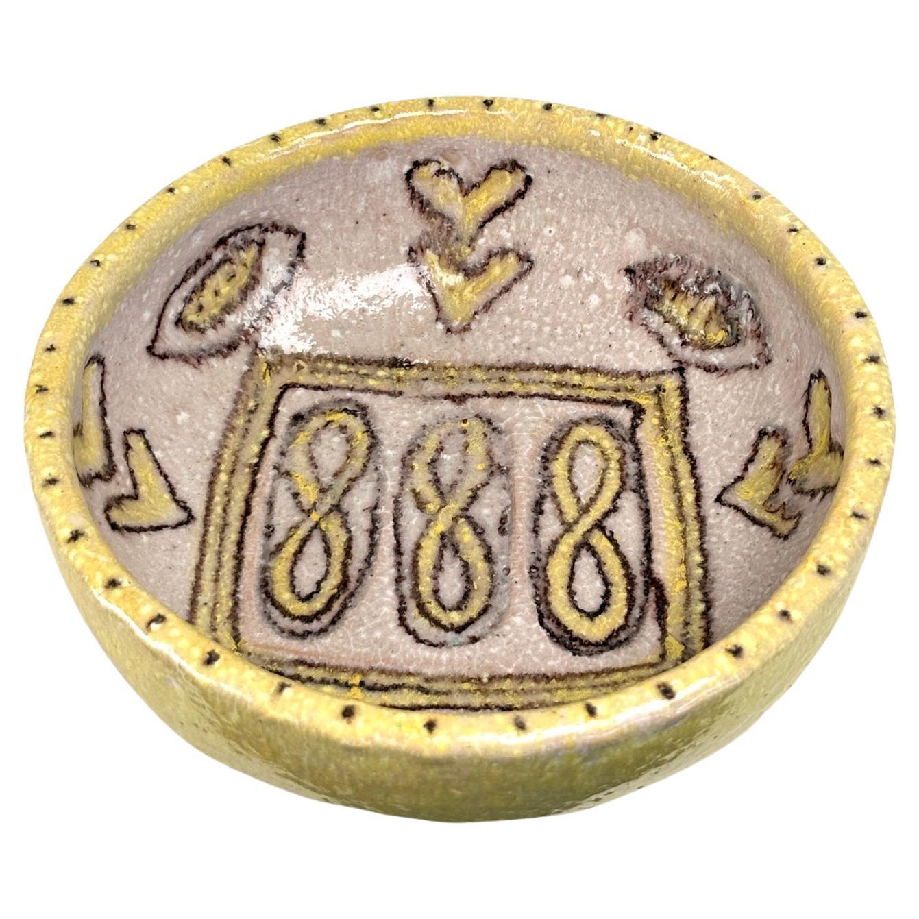 Grande ciotola in ceramica smaltata del noto e collezionatissimo artista italiano Guido Gambone.

 Un bell'esempio del suo lavoro in giallo tenue e superficie dai toni neutri con firma sul fondo che riporta il nome dell'artista e un asino