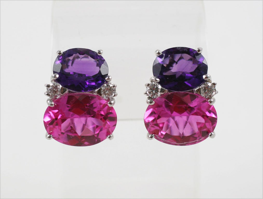 Beautiful Large 18kt white gold GUM DROP™ earrings with Amethyst (approximately 5 cts each), Pink topaz (approximately 12 cts each), and 4 diamonds weighing 0.60 cts.

Specifications: Height: 7/8