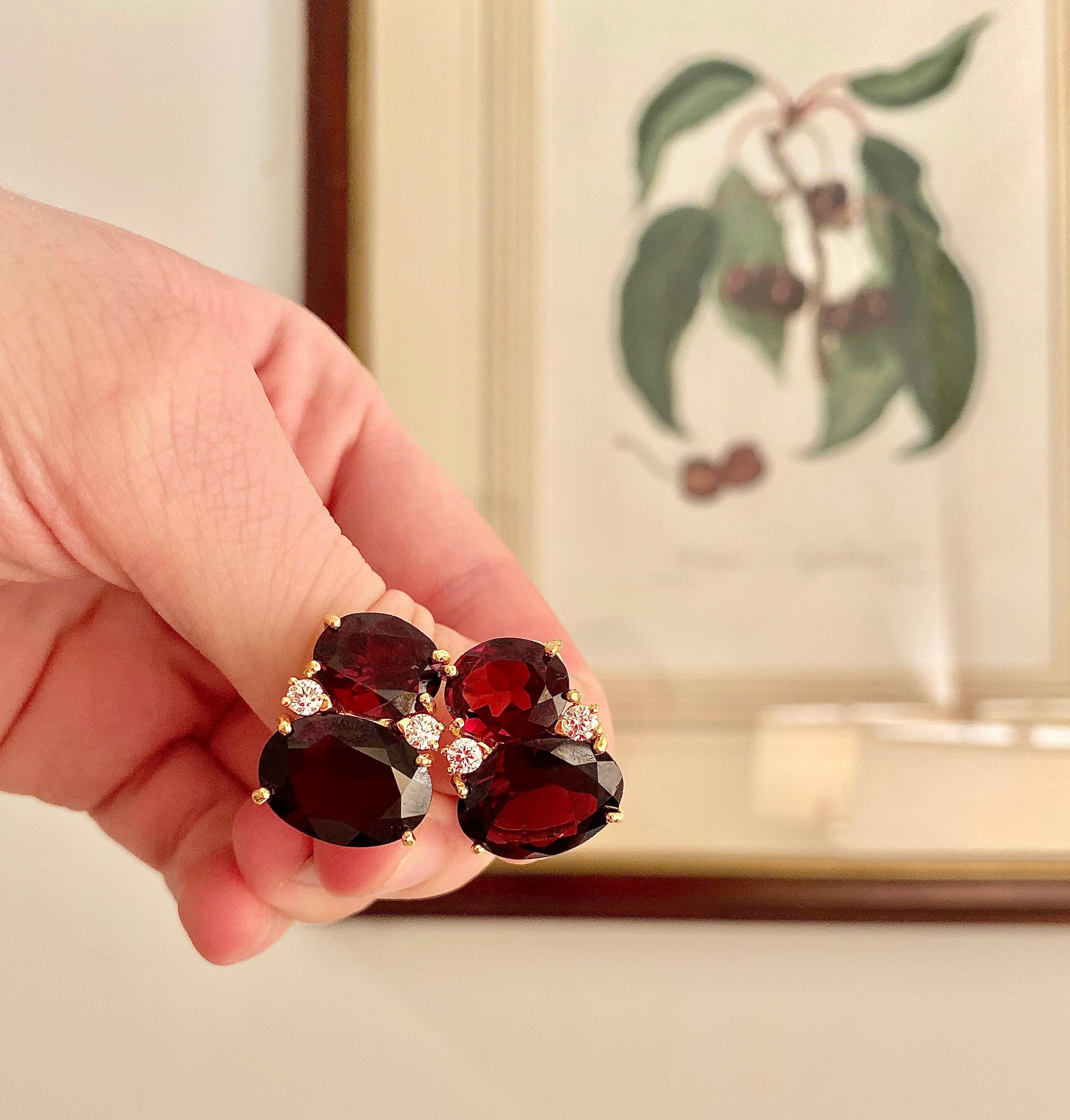 18kt Yellow Gold Large GUM DROP™ Clip Earrings with faceted Garnet and diamonds.

The Citrine is approximately 5 cts each and the Cabochon Citrine is approximately 12 cts each, and 4 diamonds weighing approximately 0.60cts

The earrings measure 1