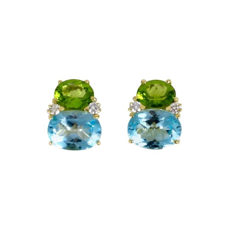 Elegant Large GUM DROP™ Earrings en or jaune 18kt avec péridot (environ 5 cts chacun), topaze bleue (environ 12 cts chacun), et 4 diamants pesant 0,60 cts.

Spécifications : Hauteur : 7/8