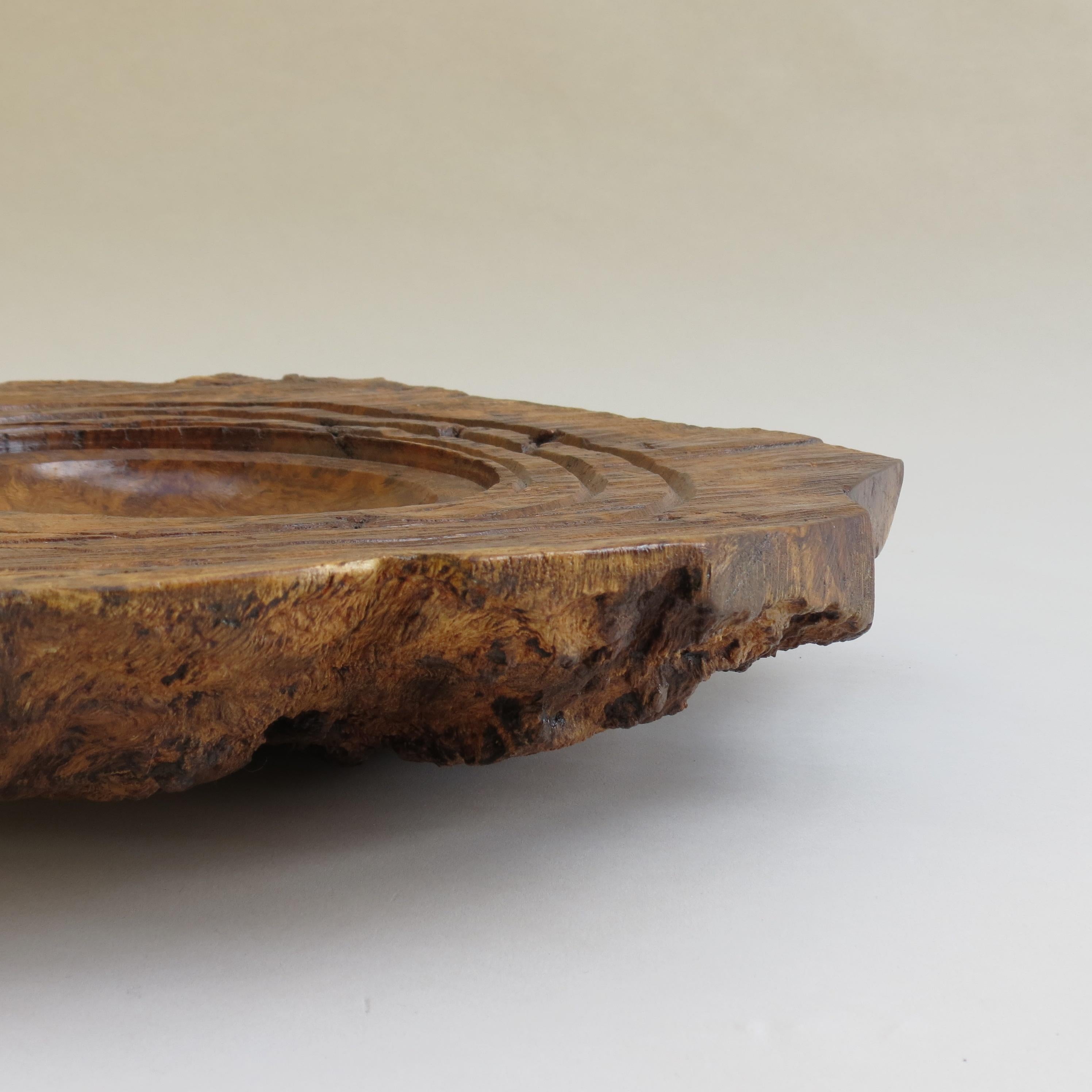 A large naturalistic bowl made from solid gum wood.  Hand turned by Mike Scott 'Chai', 1980s

Wonderful texture to this piece, the centre has a very smooth precise bowl surrounded by irregular turned rings, contrasting against saw marks to the