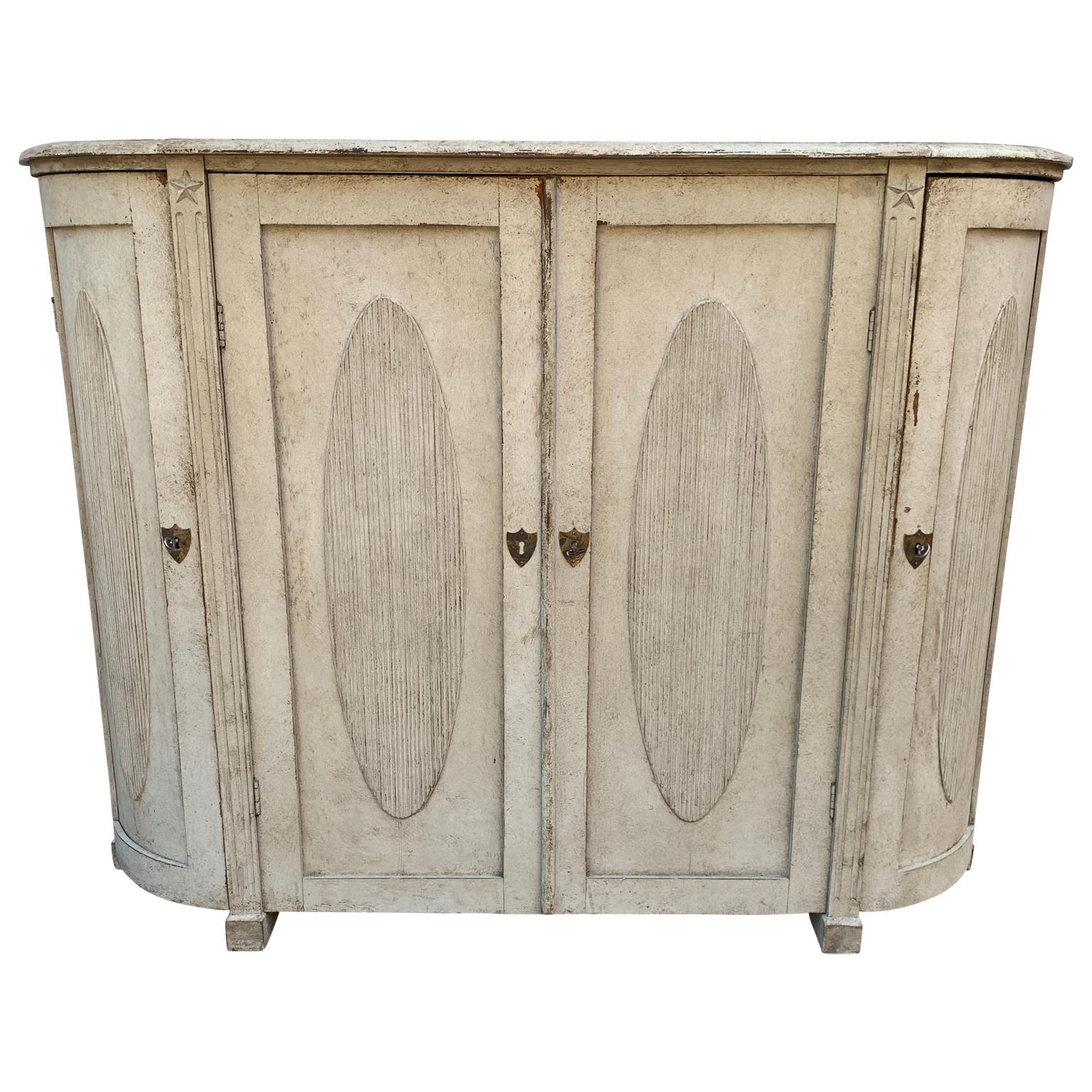 Large Curved 4 Door Gustavian Sideboard.
The sideboard is carved and with a gray painted wood finish.

 

