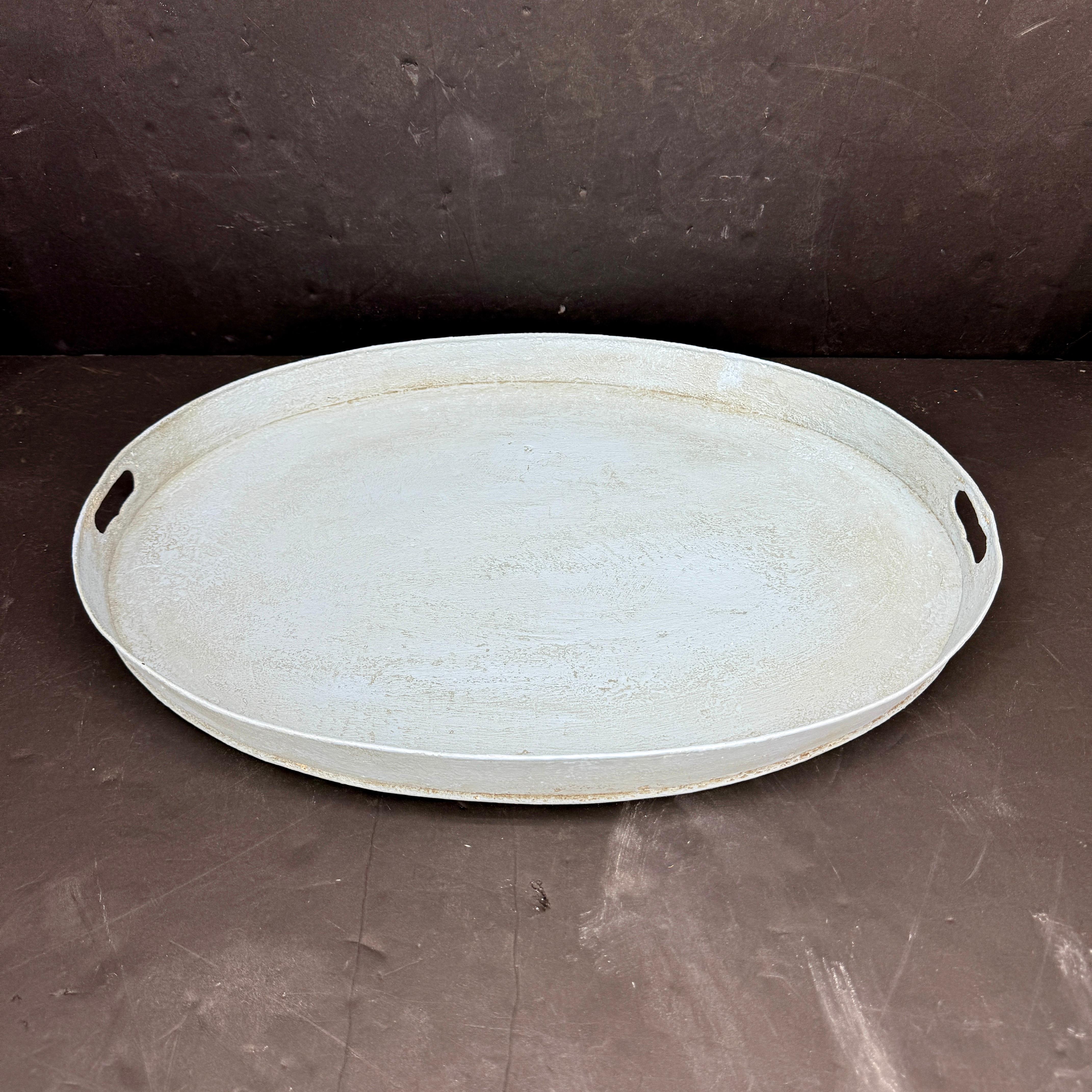 Fantastic patina on this 19th Century metal painted tray. We see this tray either on an ottoman or coffee table. Would also work well as a large bar tray in any formal or informal home. 
