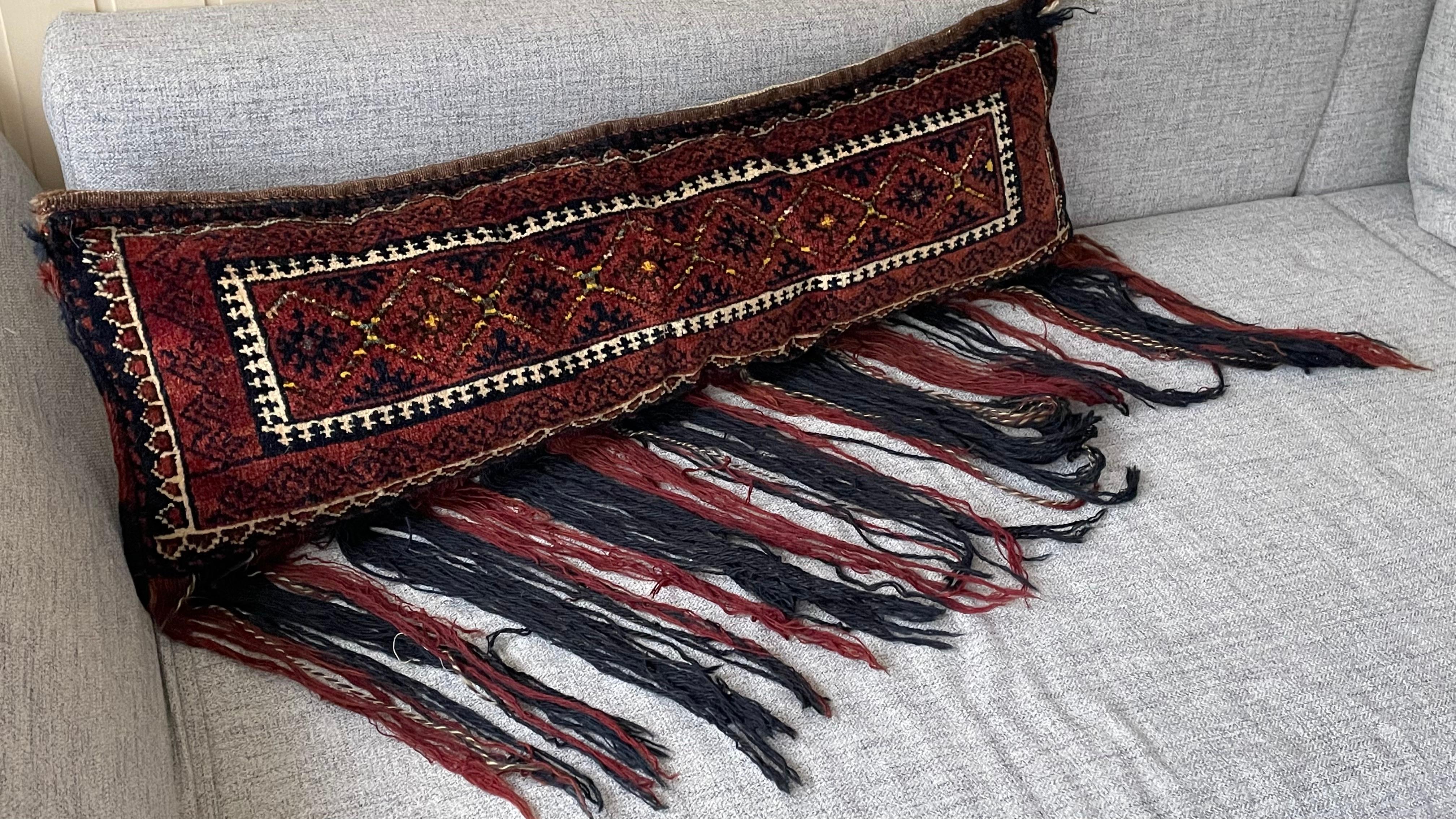 Gorgeous oriental pillow or seat pillow. Handmade of woolen salt bag or Oriental rug. A beautiful item to put on your leather sofa or a bench. The height including the fringes is approx. 24