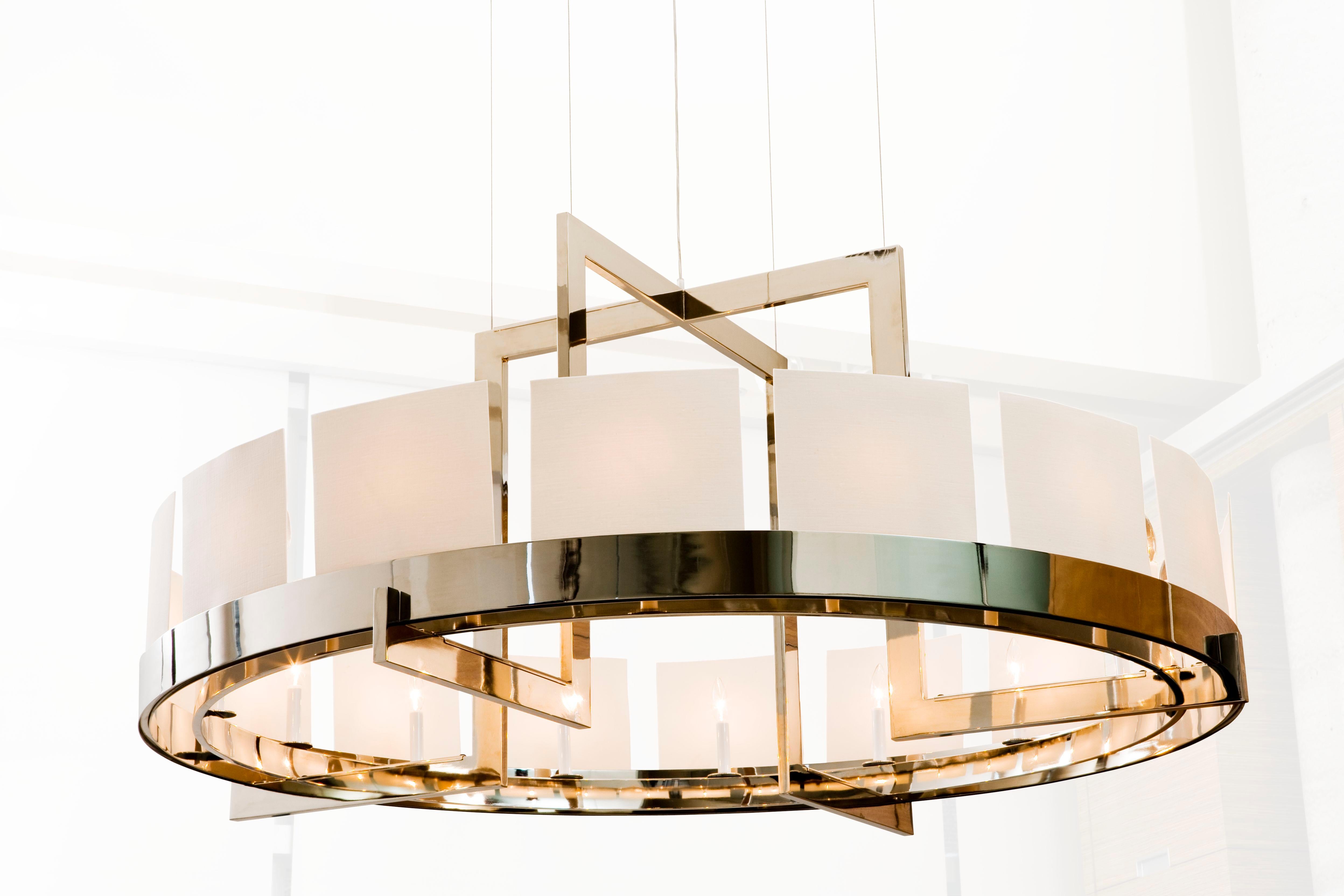 Chandelier with metal frame and 16 handmade translucent porcelain diffusers. Ceiling armature/canopy with four stainless steel cable suspensions, height adjustable. Inc/cand/max 40W. ULC equivalent / CSA approved. 120v 40w. Note: All shades are