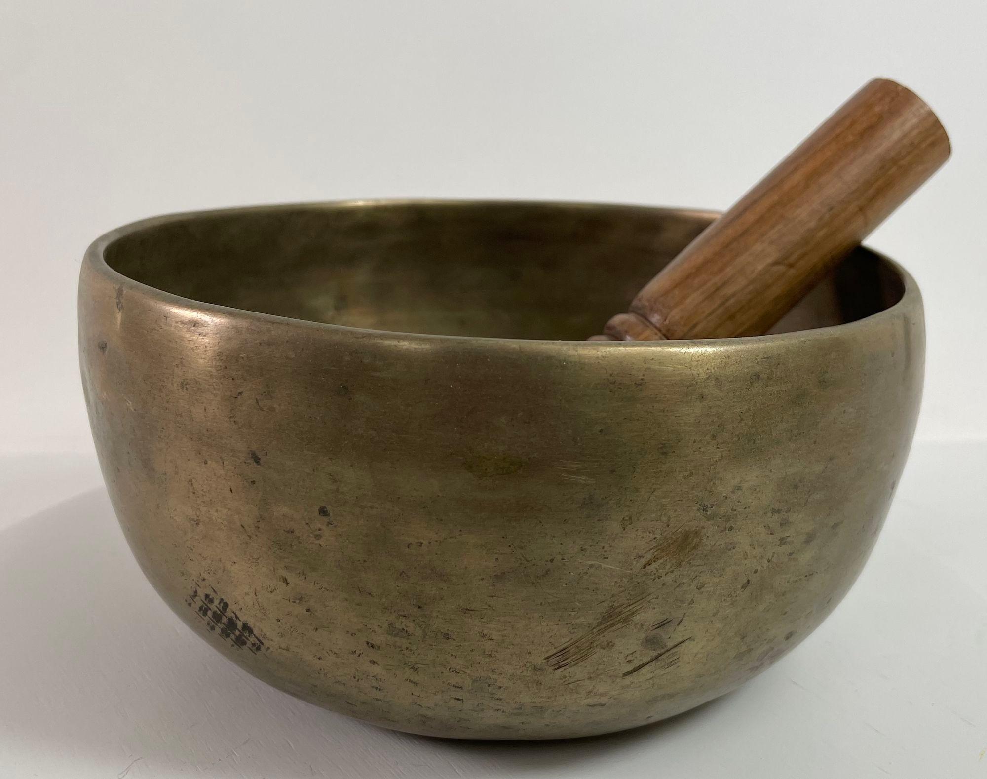 Large hand-hammered Tibetan bronze bowl, they are used in some Buddhist religious practices to accompany periods of meditation and chanting.
They have become popular with music therapists, sound healers and yoga practitioners.
The singing bowl is