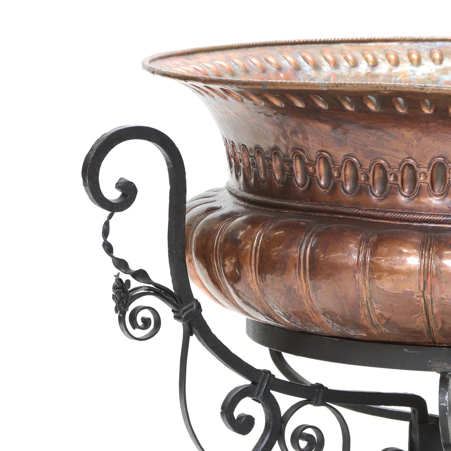American Craftsman Large Hammered Copper Planter in a Fitted Wrought Iron Scrolled Base For Sale