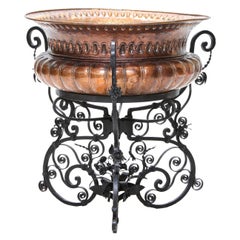 Large Hammered Copper Planter in a Fitted Wrought Iron Scrolled Base
