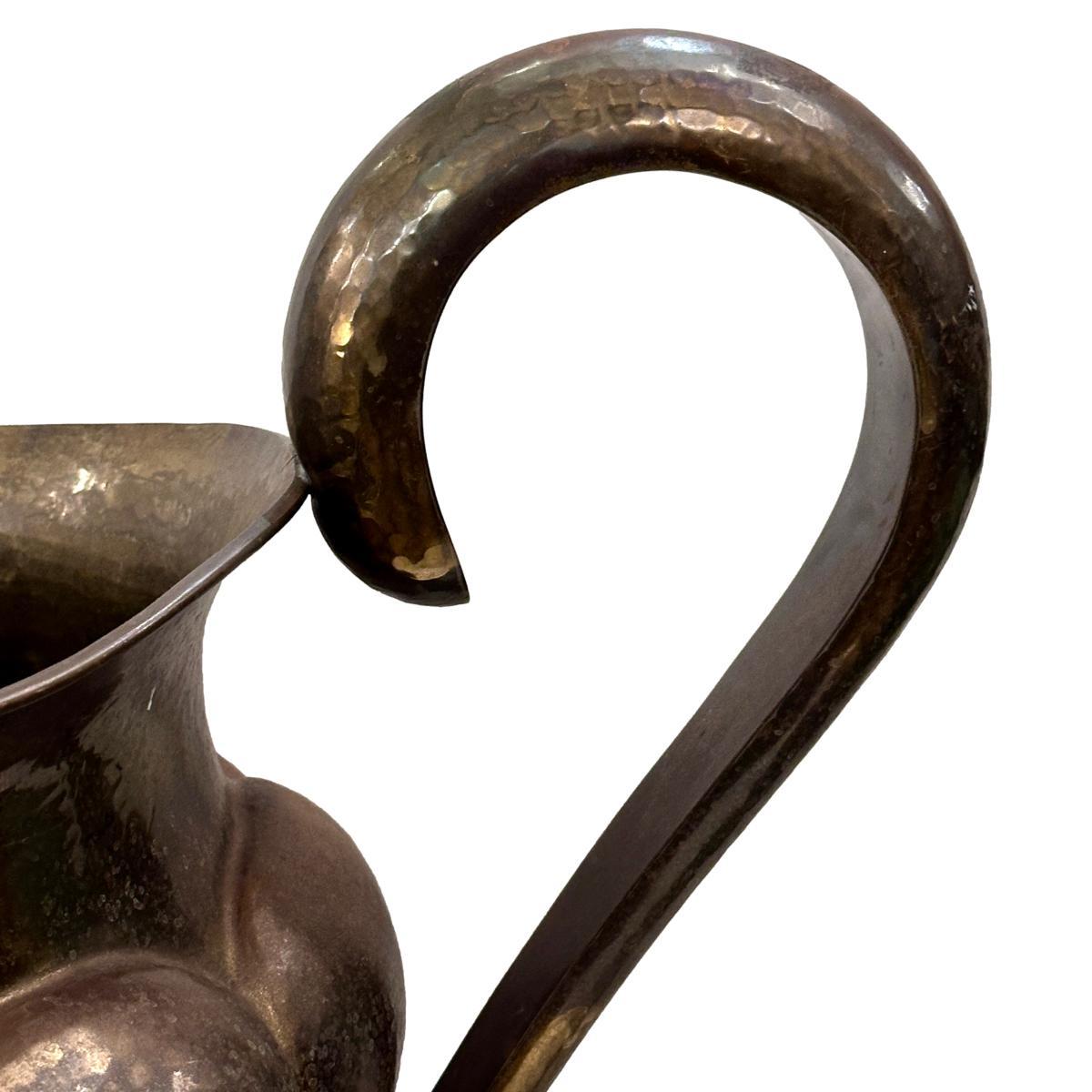 A large circa 1930's Italian hammered brass ewer with original patina.

Measurements:
Height: 23