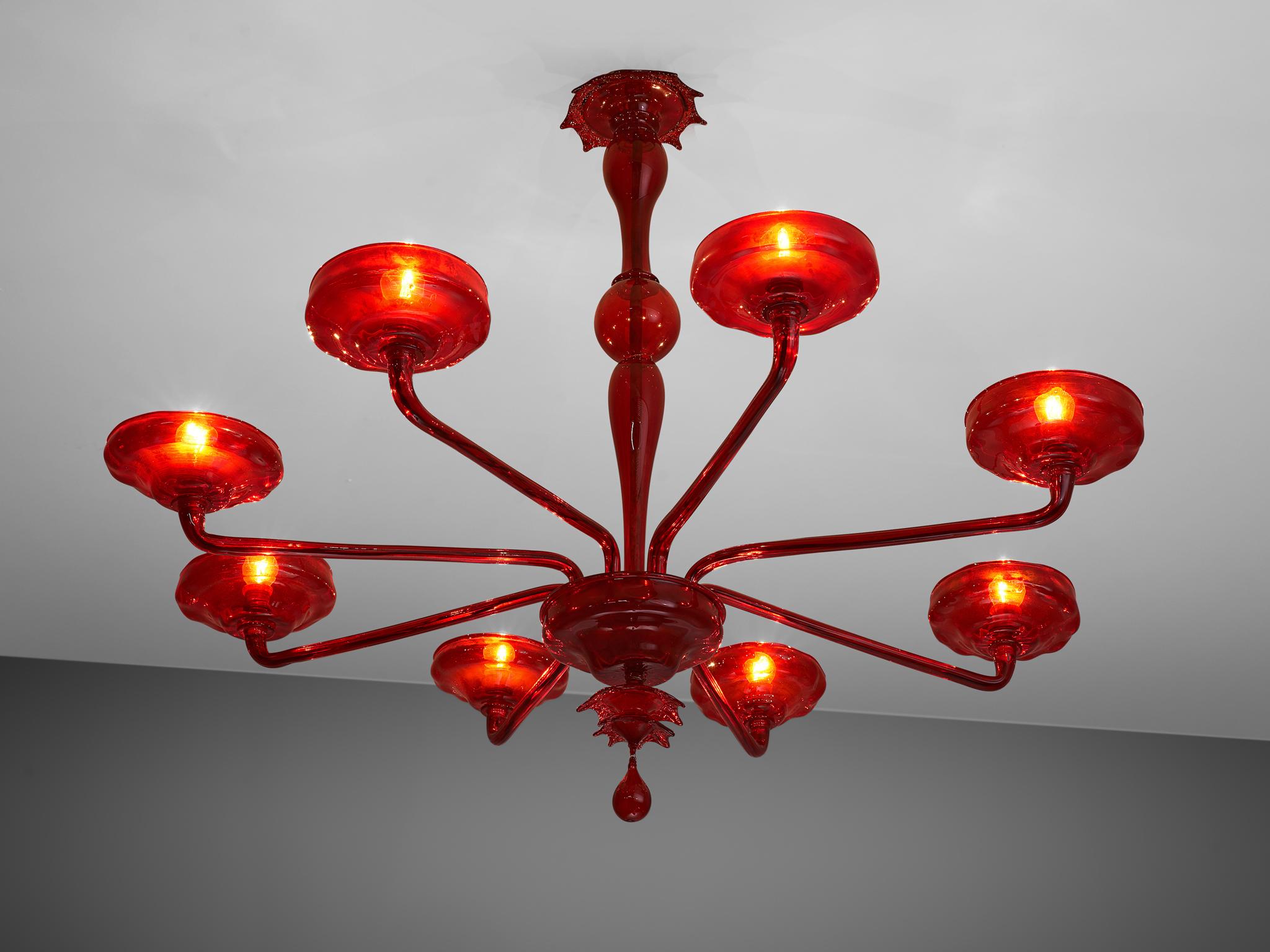  Chandelier, Murano glass, Italy, 1960s

1960s Venetian chandelier composed of ruby red Murano glass. Handcrafted and executed with modern lines in combination with the elegance of Venetian traditions. The eight long arms, each holding a bowl