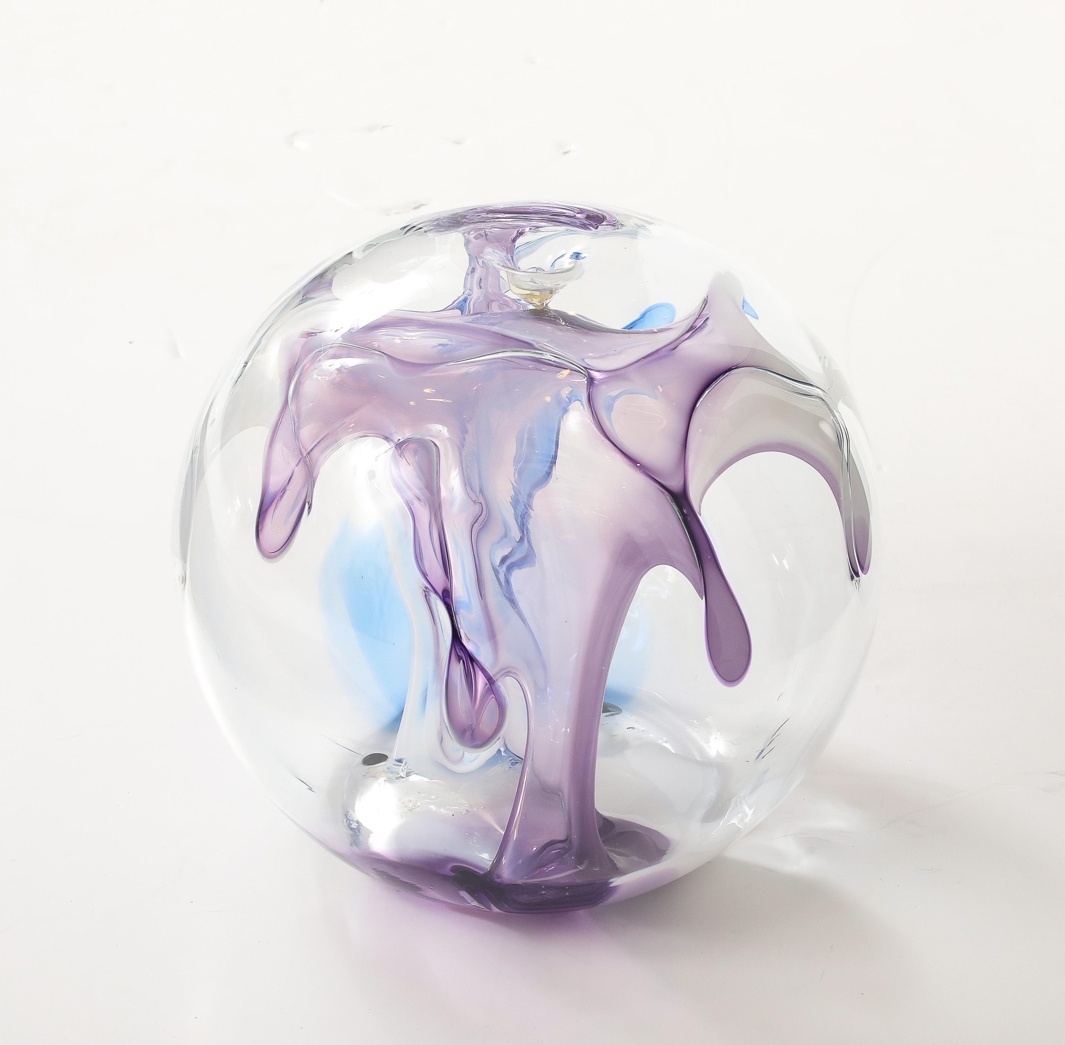Large hand blown glass Orb sculpture by Peter Bramhall signed and dated August 1988.
A Wonderful combination of Purple, Blue, White and Clear internal glass threads create this large
beautiful glass orb sculpture.
