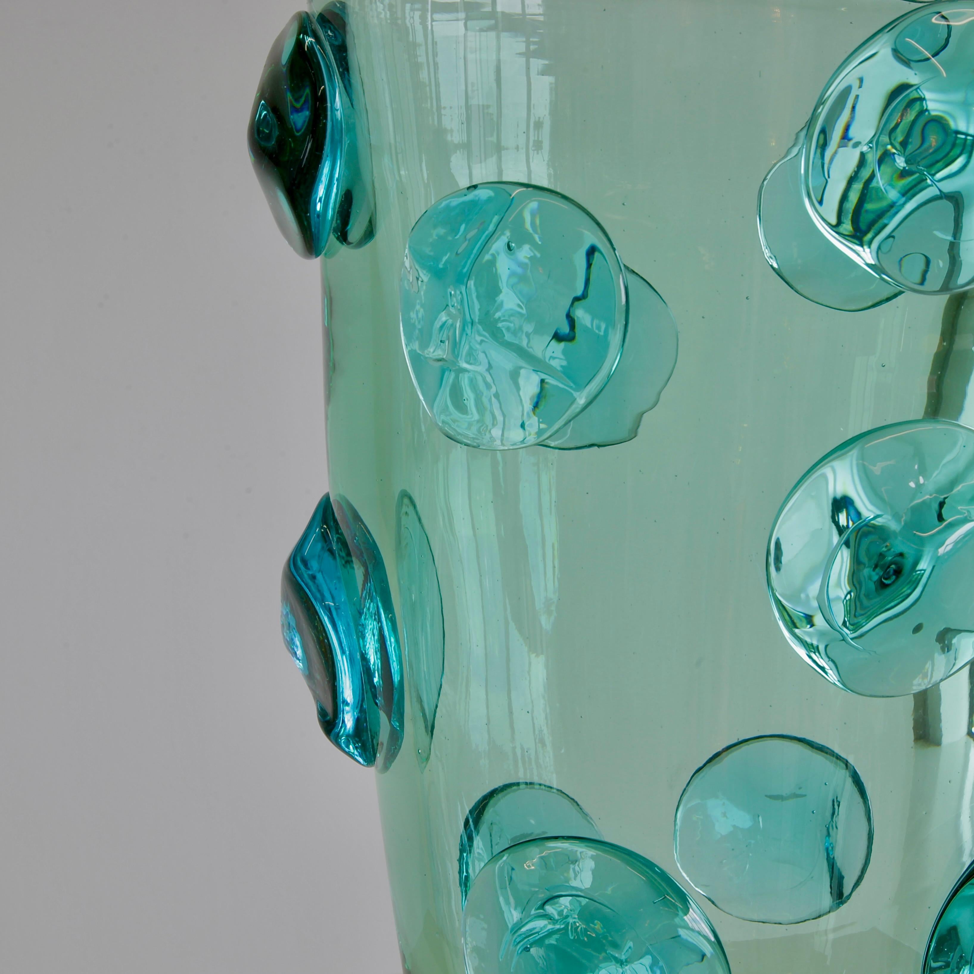 Large hand-blown glass vase, Italy, Murano.

Green glass vase with glass decorations, engraved with signature on base. Heavy and decorative piece, made in Murano. Signed.

.