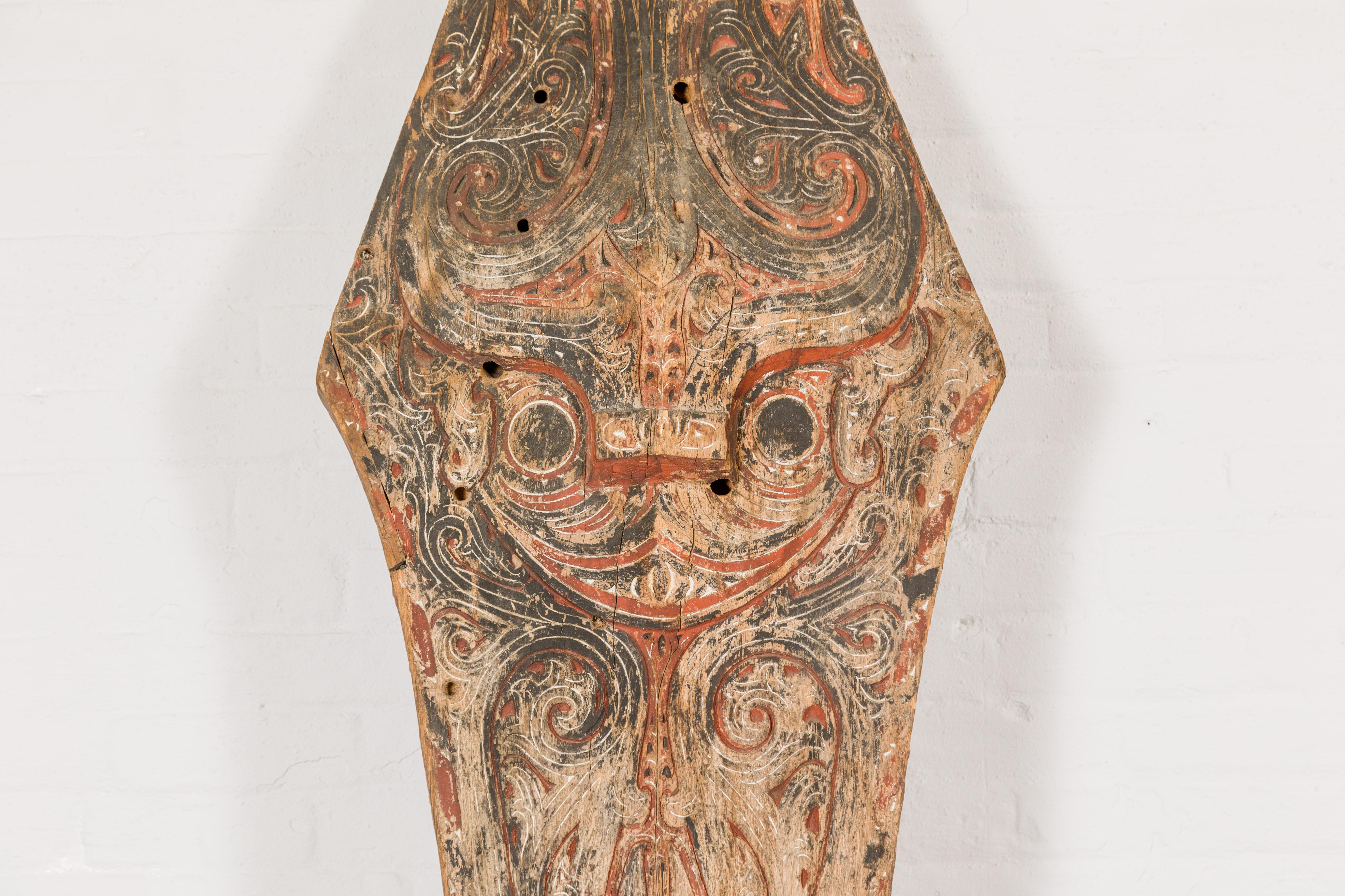 Hand-Carved Large Hand Carved Batak Singa Singa Tribal Carving with Black and Red Paint For Sale