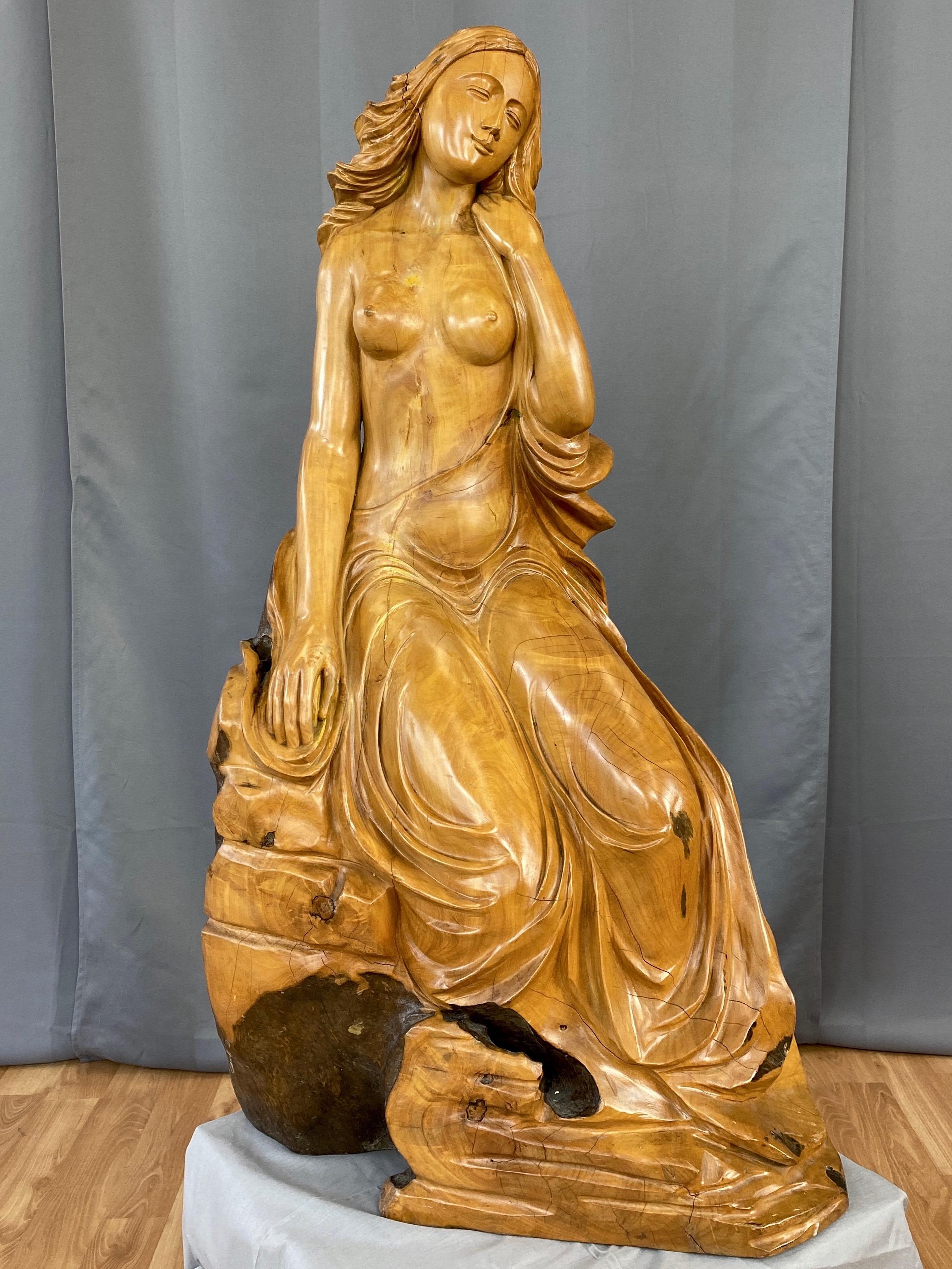 An impressively sized and strikingly beautiful semi-nude female figural sculpture strongly evocative of Sandro Botticelli's 